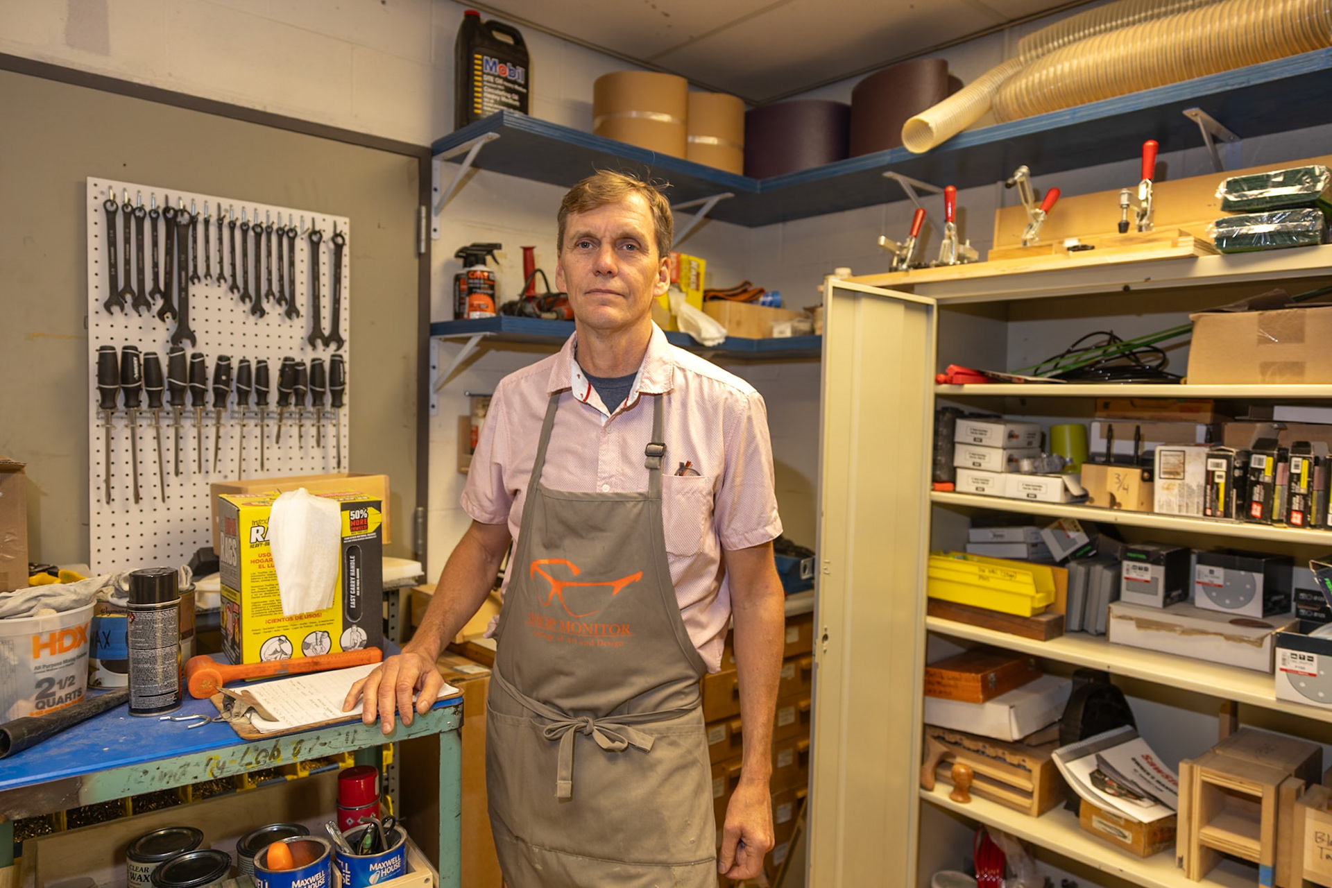 Rolf Hoeg, furniture design professor, stands in a storage closet in the furniture design studio at RIT in Rochester, New York on Oct. 30, 2024.