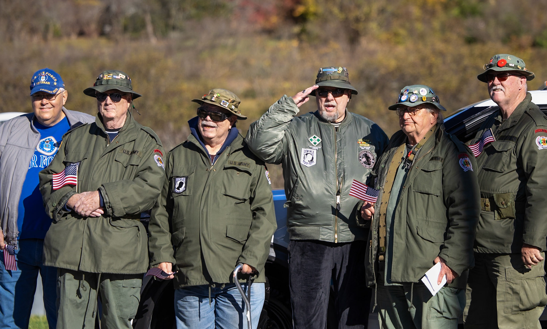 Vietnam veterans salute before the Veterans Day parade at Highland Park in Rochester, New York, on Nov. 9, 2024. The parade included a military band, several high school marching bands, and a memorial ceremony at the Vietnam Veterans Park.