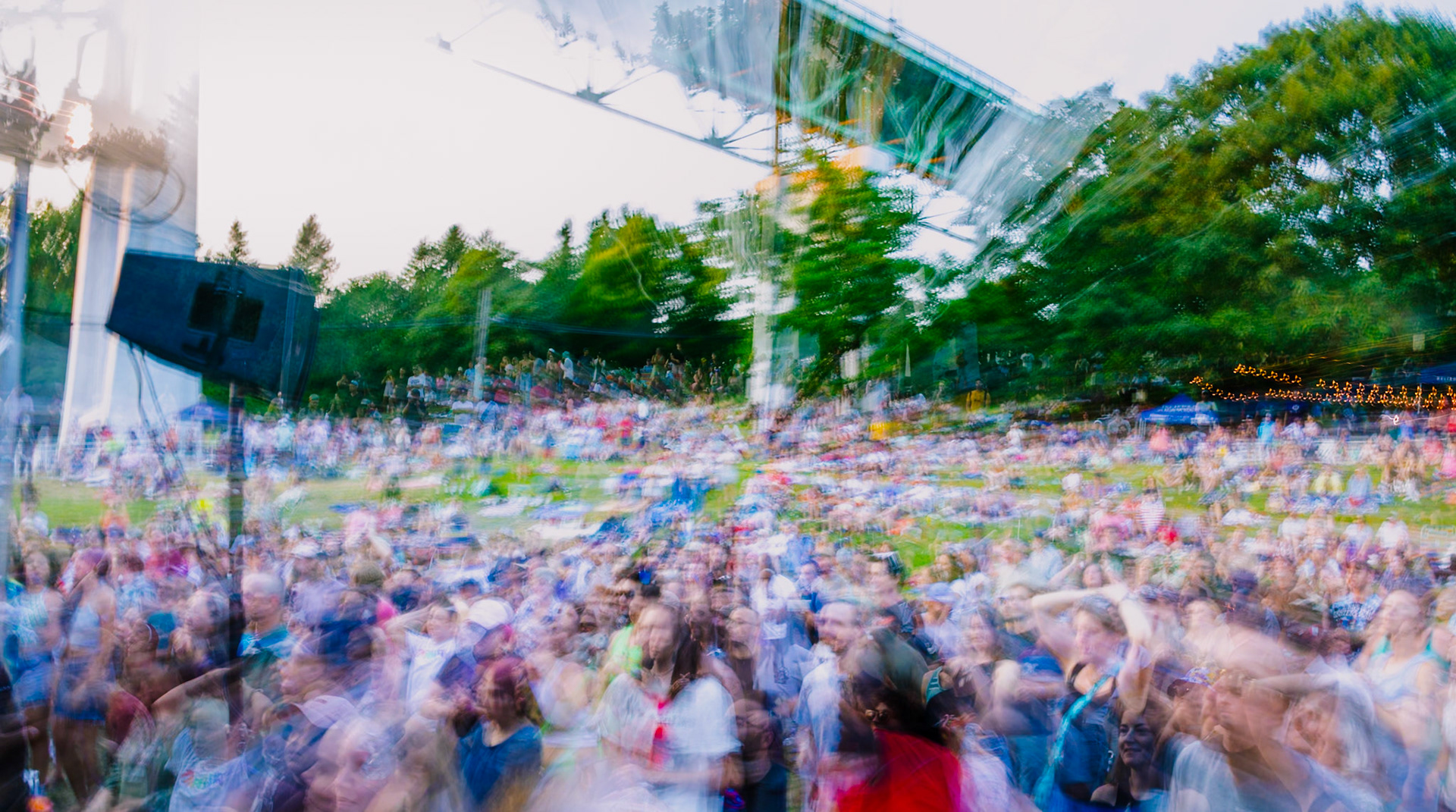 Cathedral Park Jazz Festival in St. Johns neighborhood in Portland, Oregon on July 21, 2024. Zooming out using a long exposure effect.