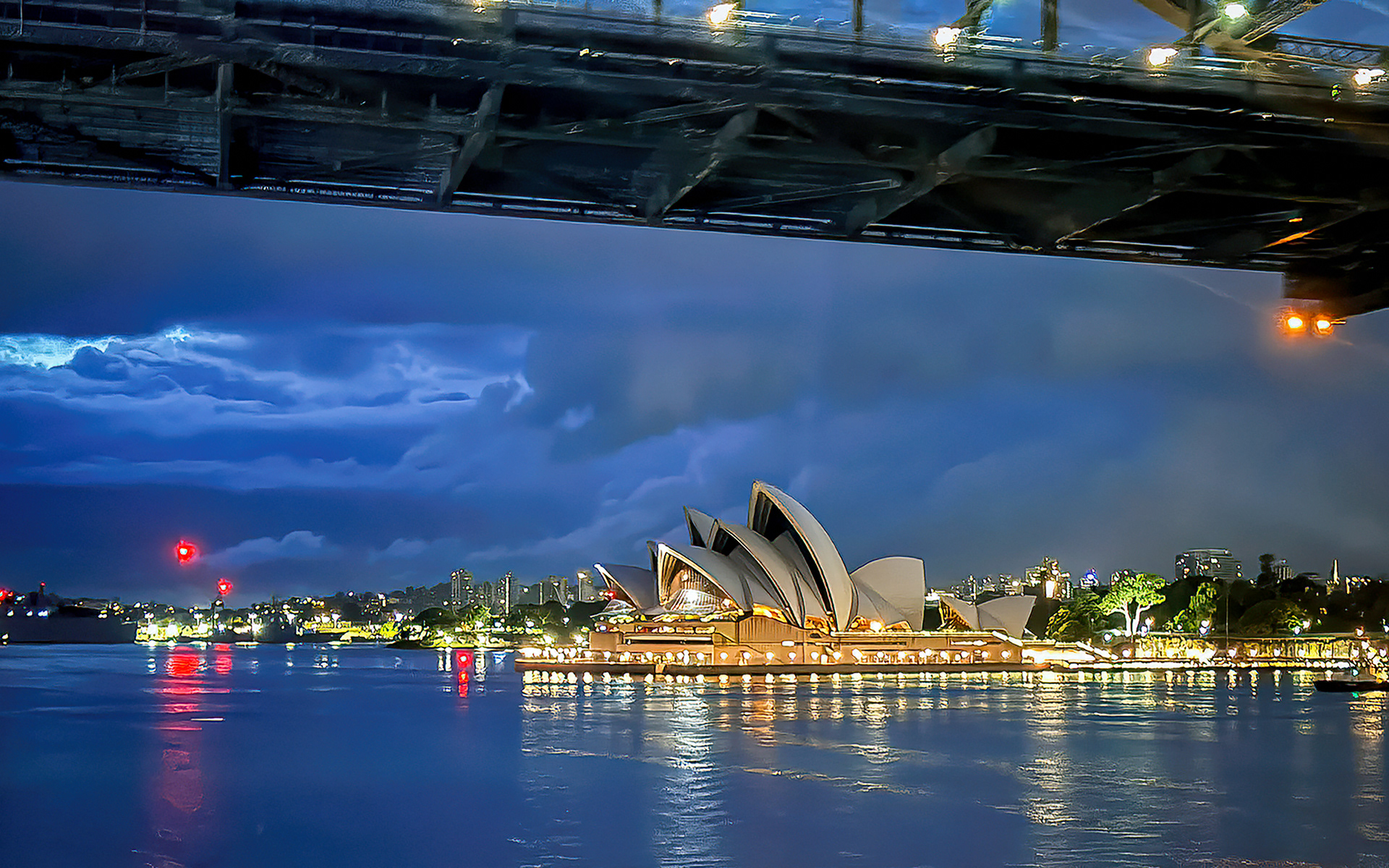 Sydney Opera House at dawn from under the Sydney Harboour Bridge.