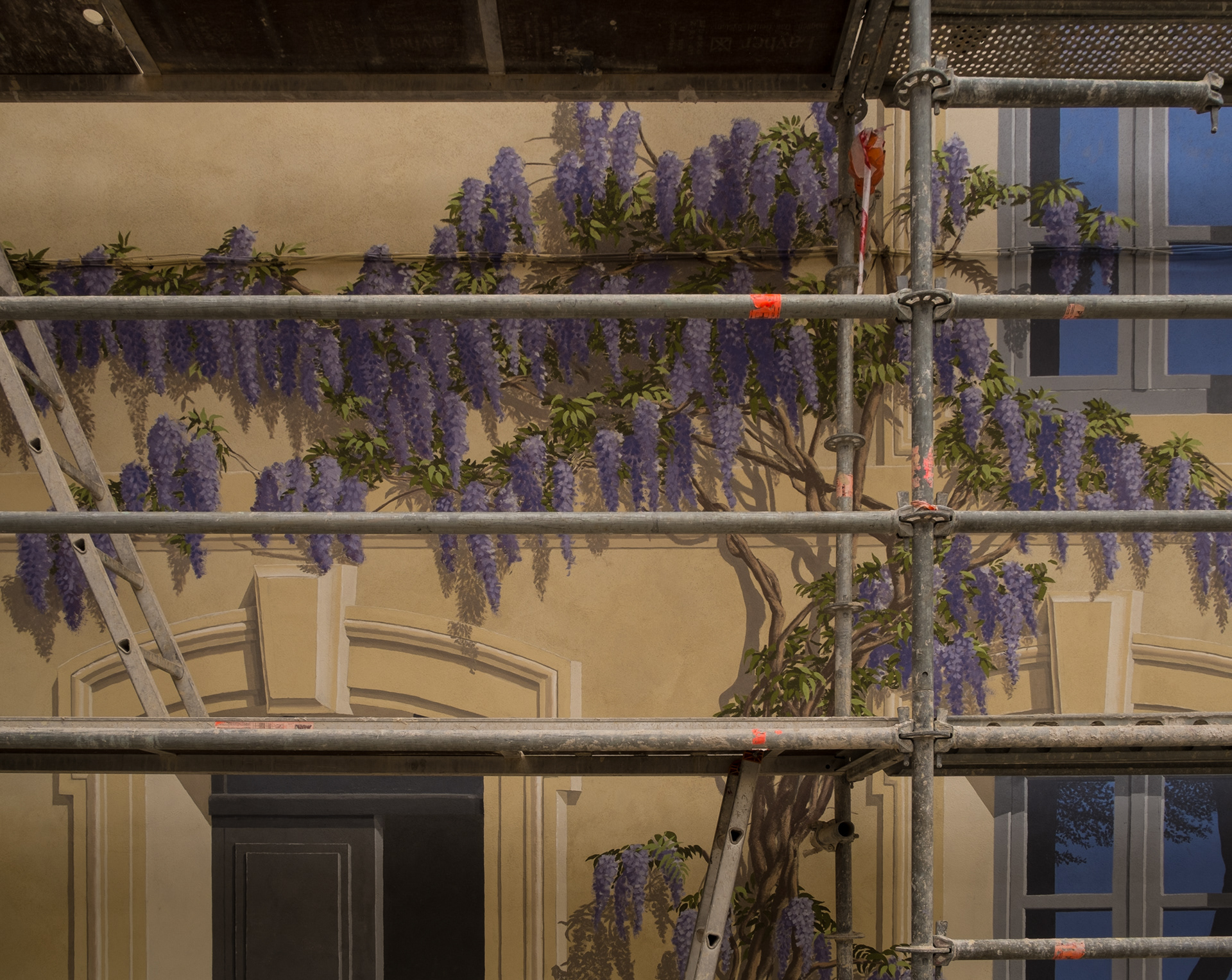 Wisteria flowers all year round in this architectural trompe-l'oeil