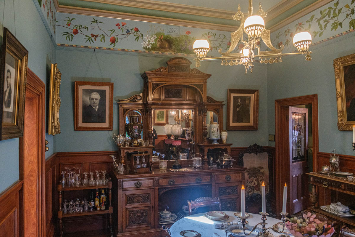 The gazes of the family portraits on the four walls watch over this scene.