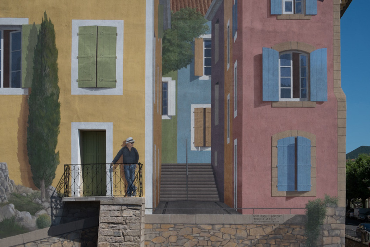 A man with a hat. Strange presence on the balcony