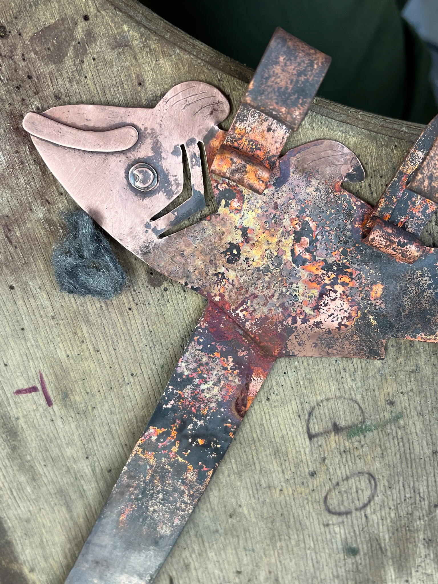 Detail shot of the beautiful patina variations that occur from the heat of the flame.  The eyes and mouth were also silver soldered on.