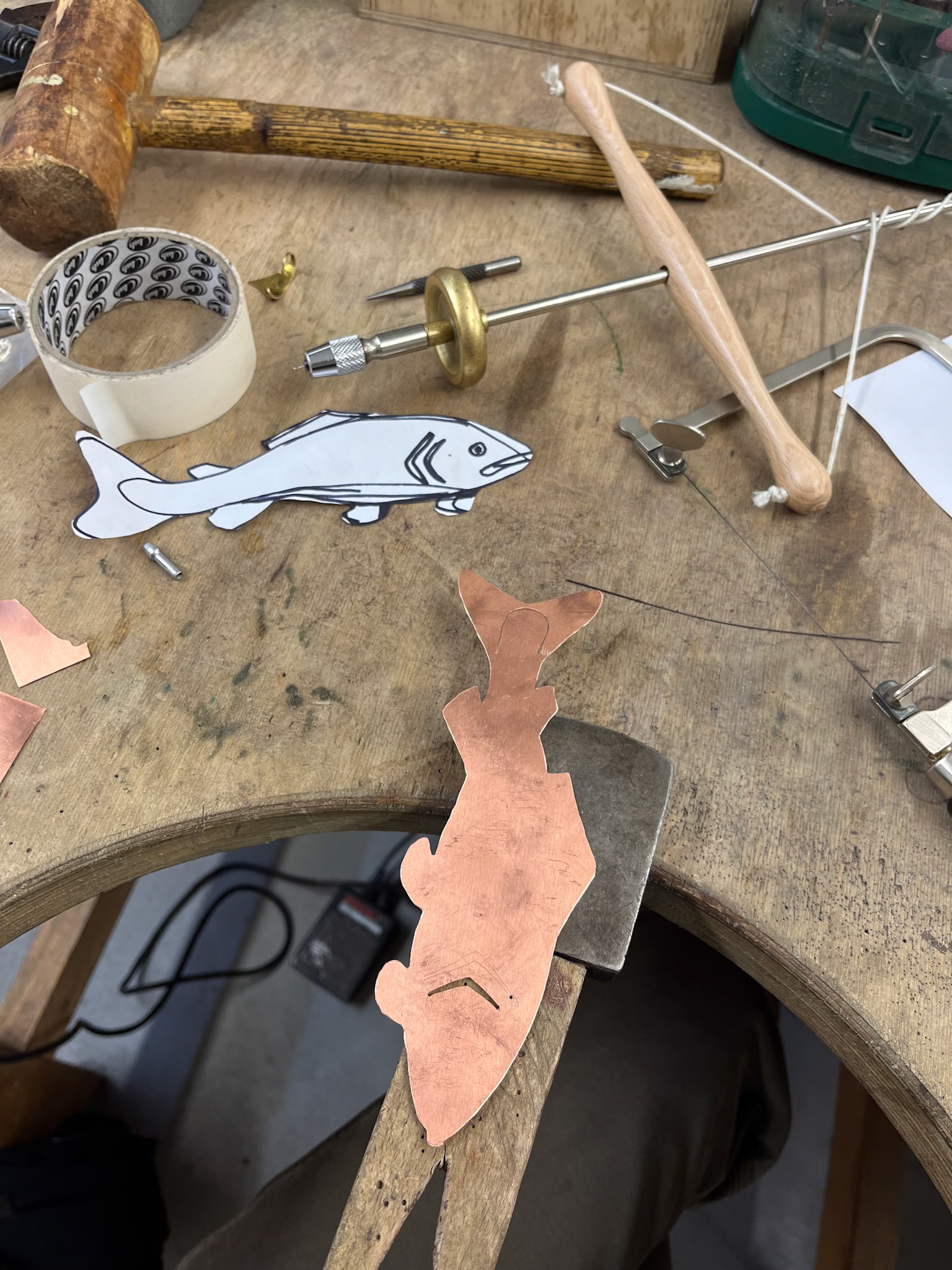 First a coping saw and pump drill were used to cut out the fish and some details.