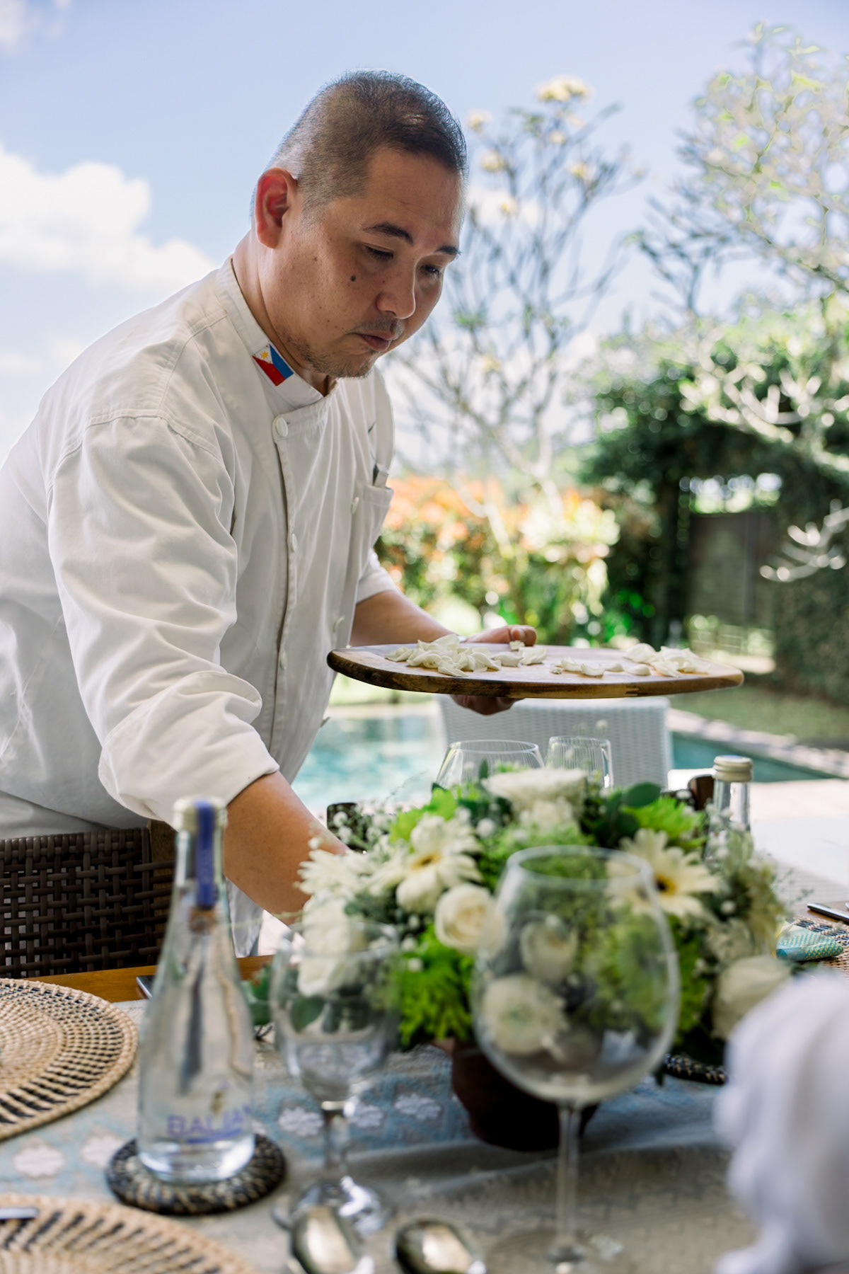 Chef Juan Gadi setting up the table for the private dining experience.