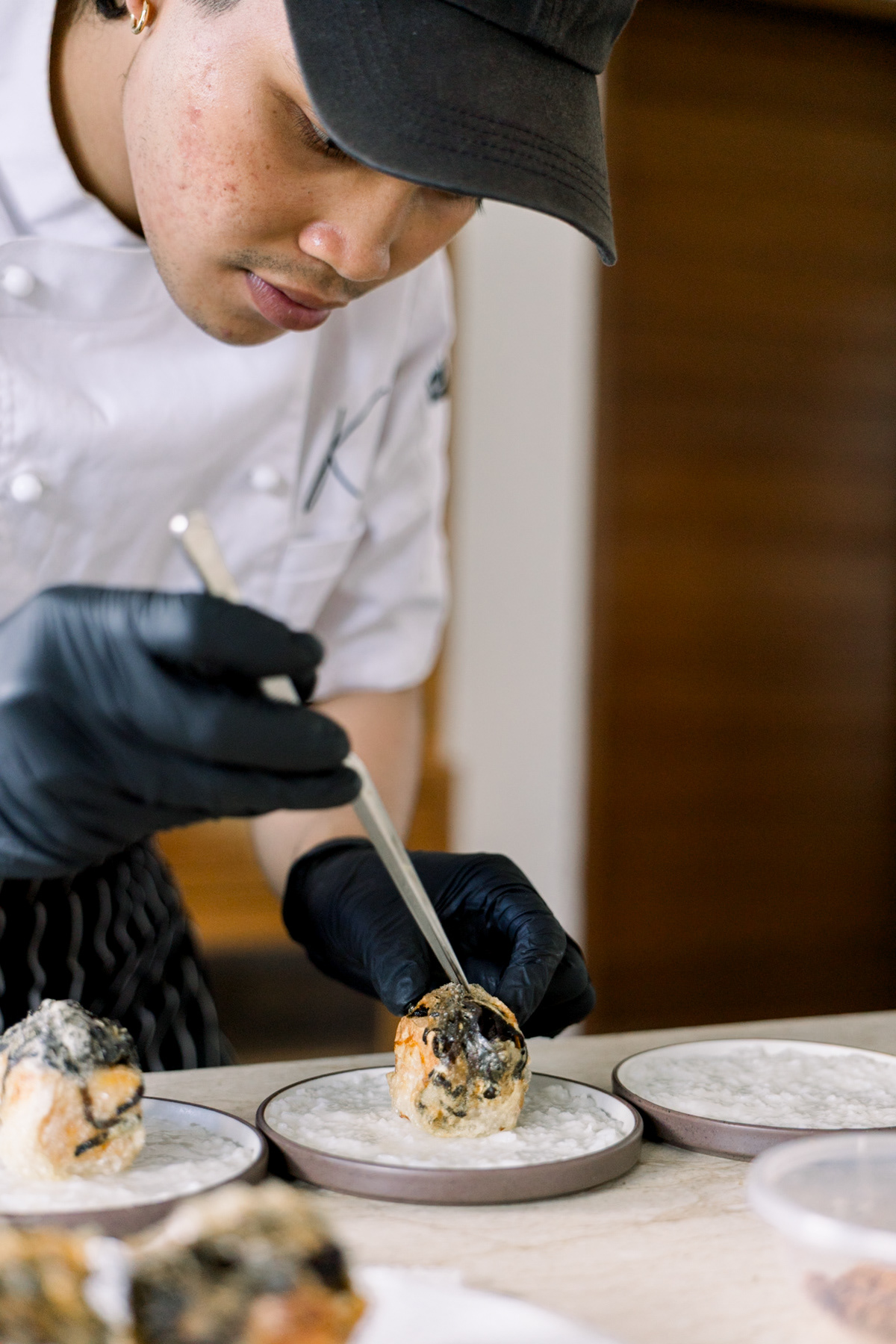Bali food stylist finishing up his creation.