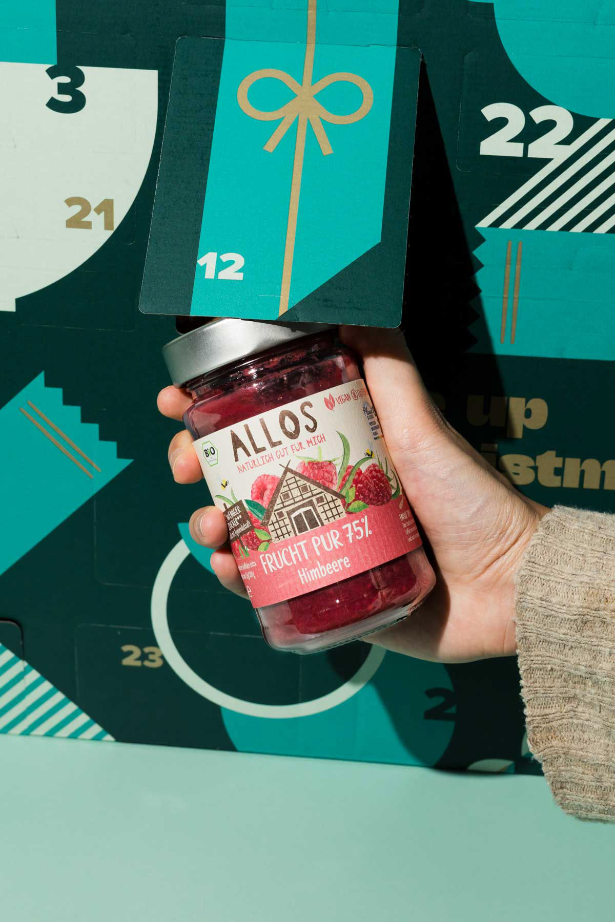 A jar of Allos product, captured by a product photographer.