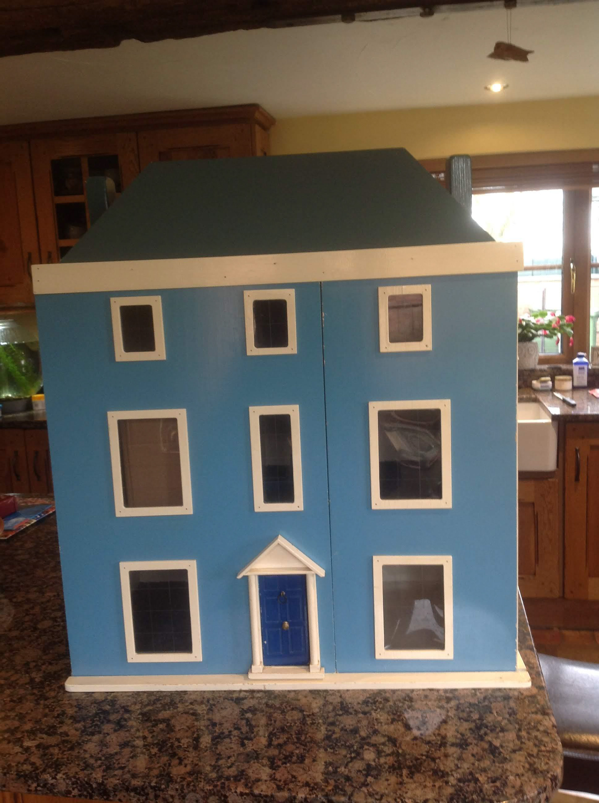Before image of the Dollshouse. This dollshouse is 40+ years old, and was built in Portsmouth. There are 9 rooms, 3 of which are landing spaces with built in stairs.