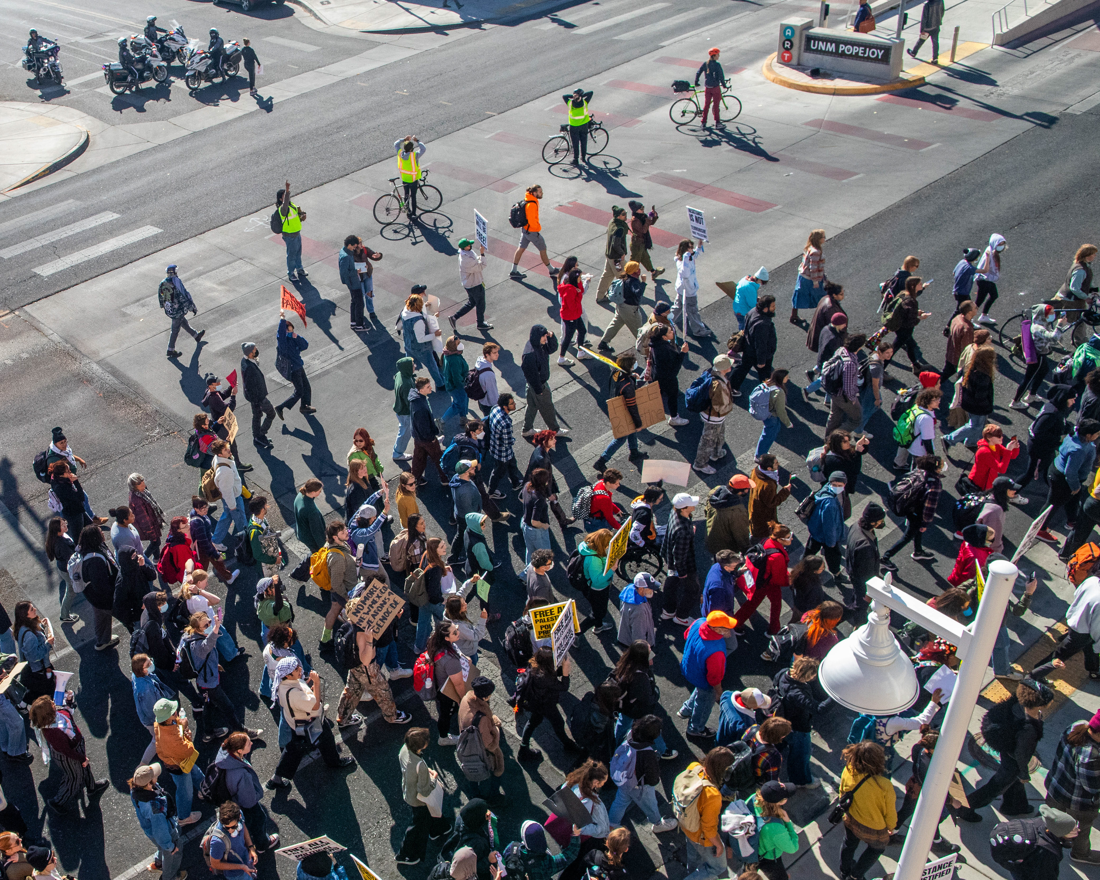 A crowd of protesters calling for ceasefire in Gaza walk on Central Ave. in Albuquerque, New Mexico, near UNM. November 9, 2023