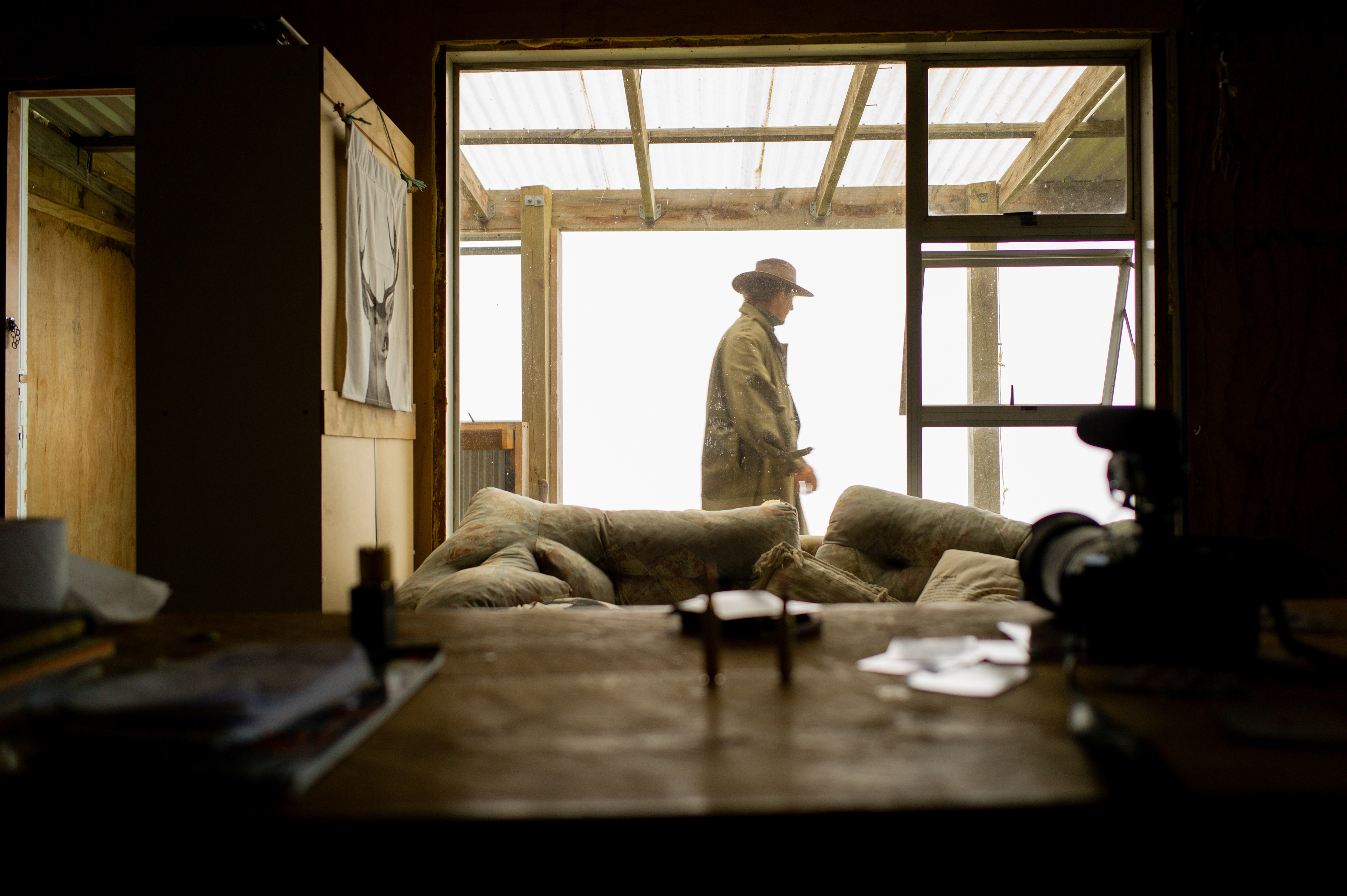 Shoot set up from inside the cabin looking out into the characters movements bringing in wood.