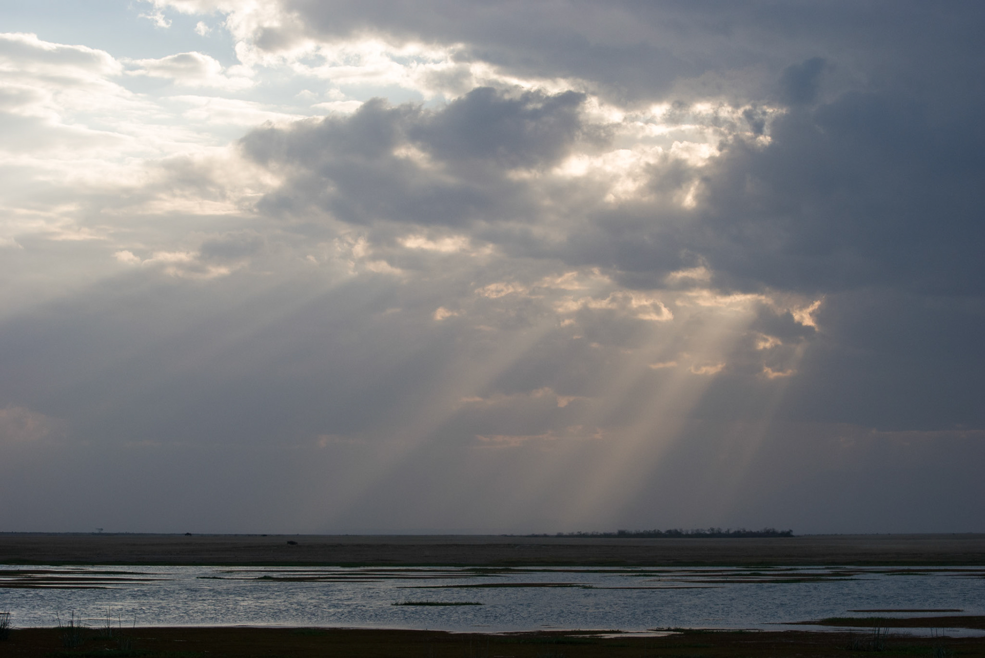 Sun breaking through the clouds in Amboseli National Park