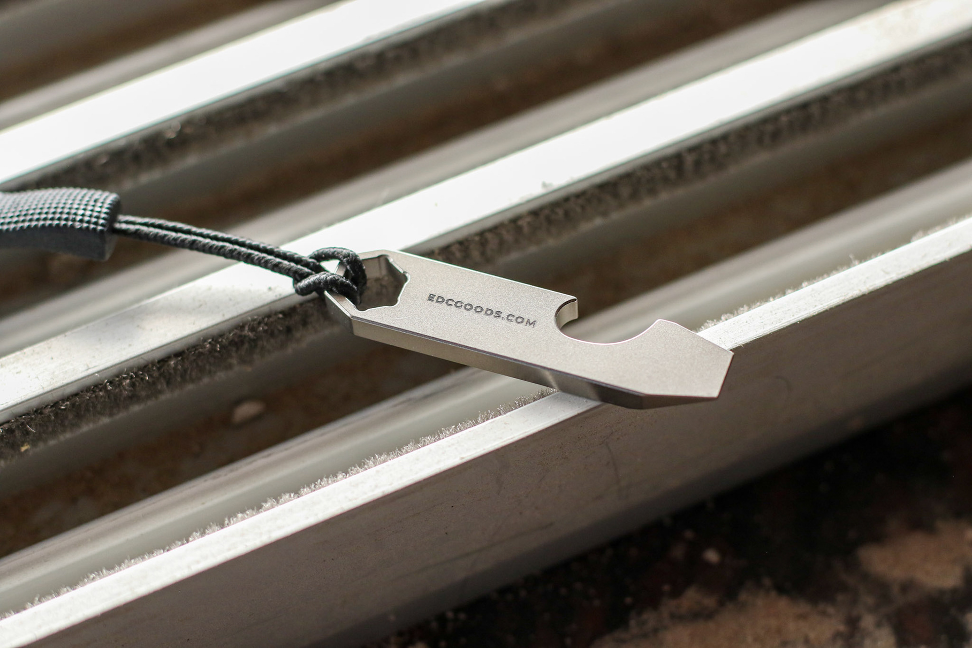 Titanium prybar lying upside down on window rails