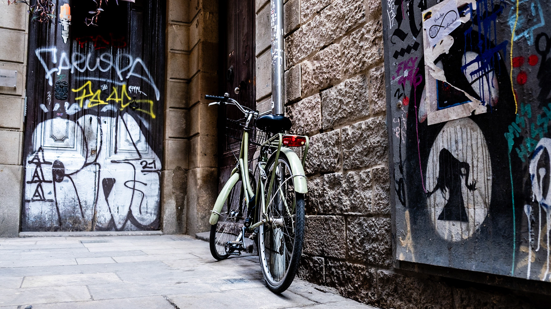 Bicycles and street art are omnipresent in Gothic Quarter in Barcelona
