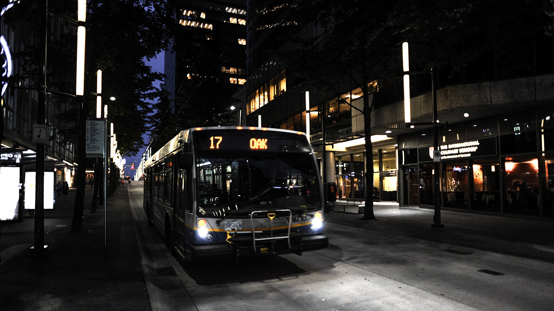 A BC Transit bus stands on a deserted Granville Street section in Vancouver West End