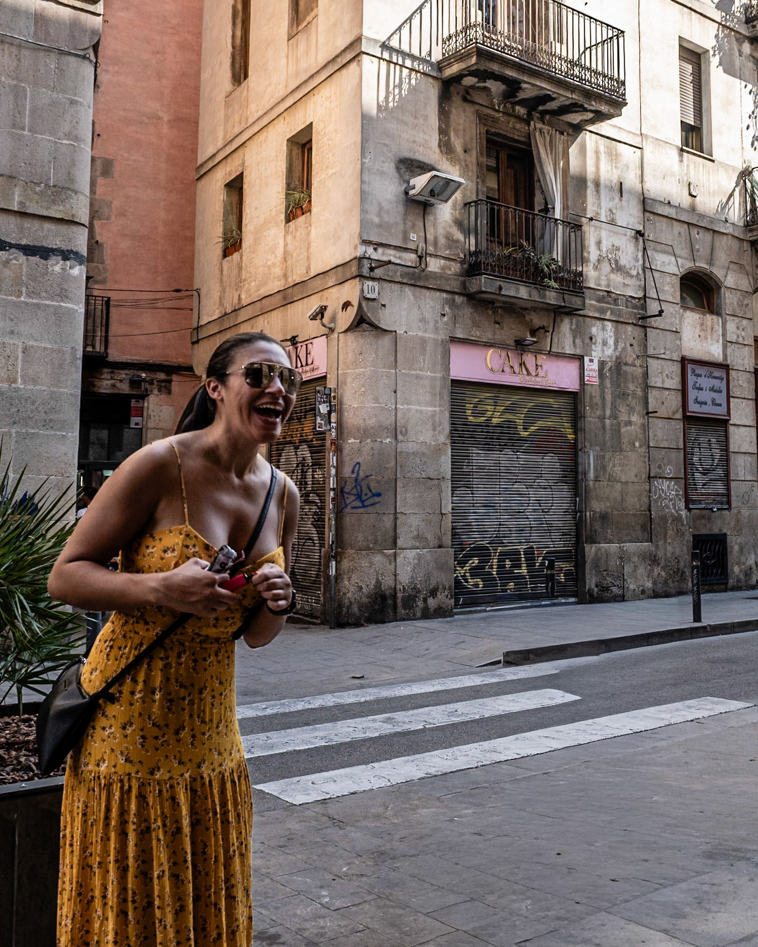 A princess converses with a coffee shop owner on Carrer de la Princesa in El Born, Barcelona