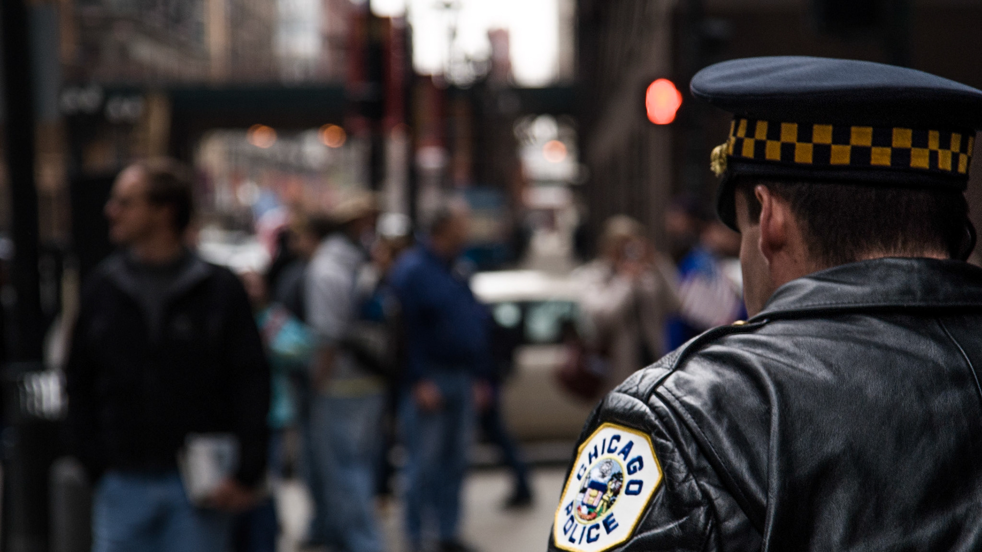 A police officer patrols Chicago streets during a peace demonstration organized by opponents of the war in Iraq