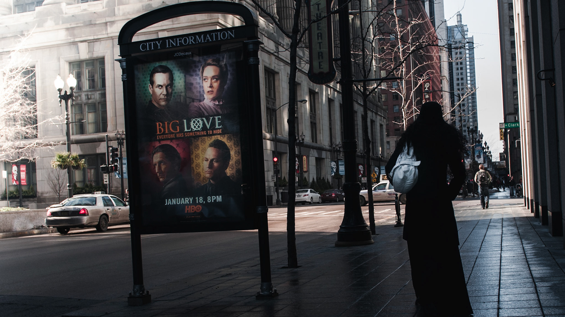 A lone lady strolls along Randolph Street in Chicago.