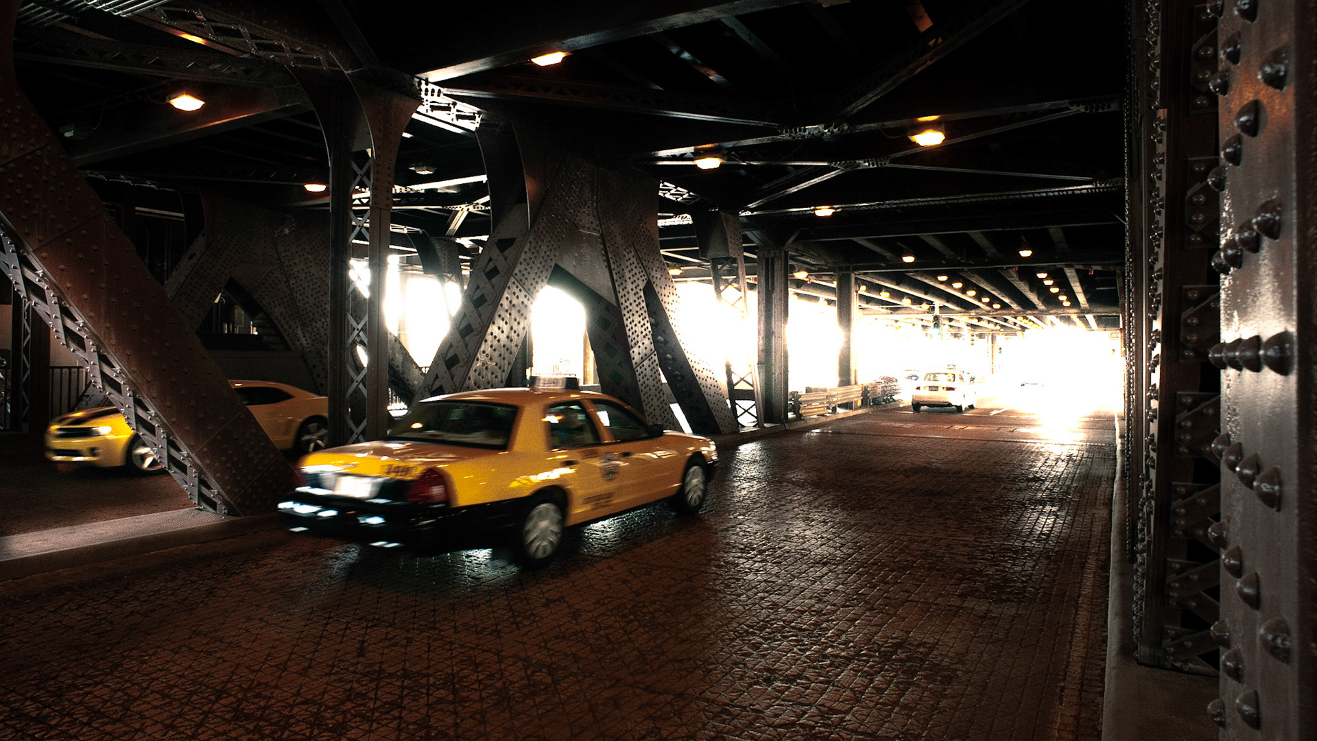 A taxi cab crosses the Chicago River on the lower section of the Lake Shore Drive bridge near Wacker Drive.