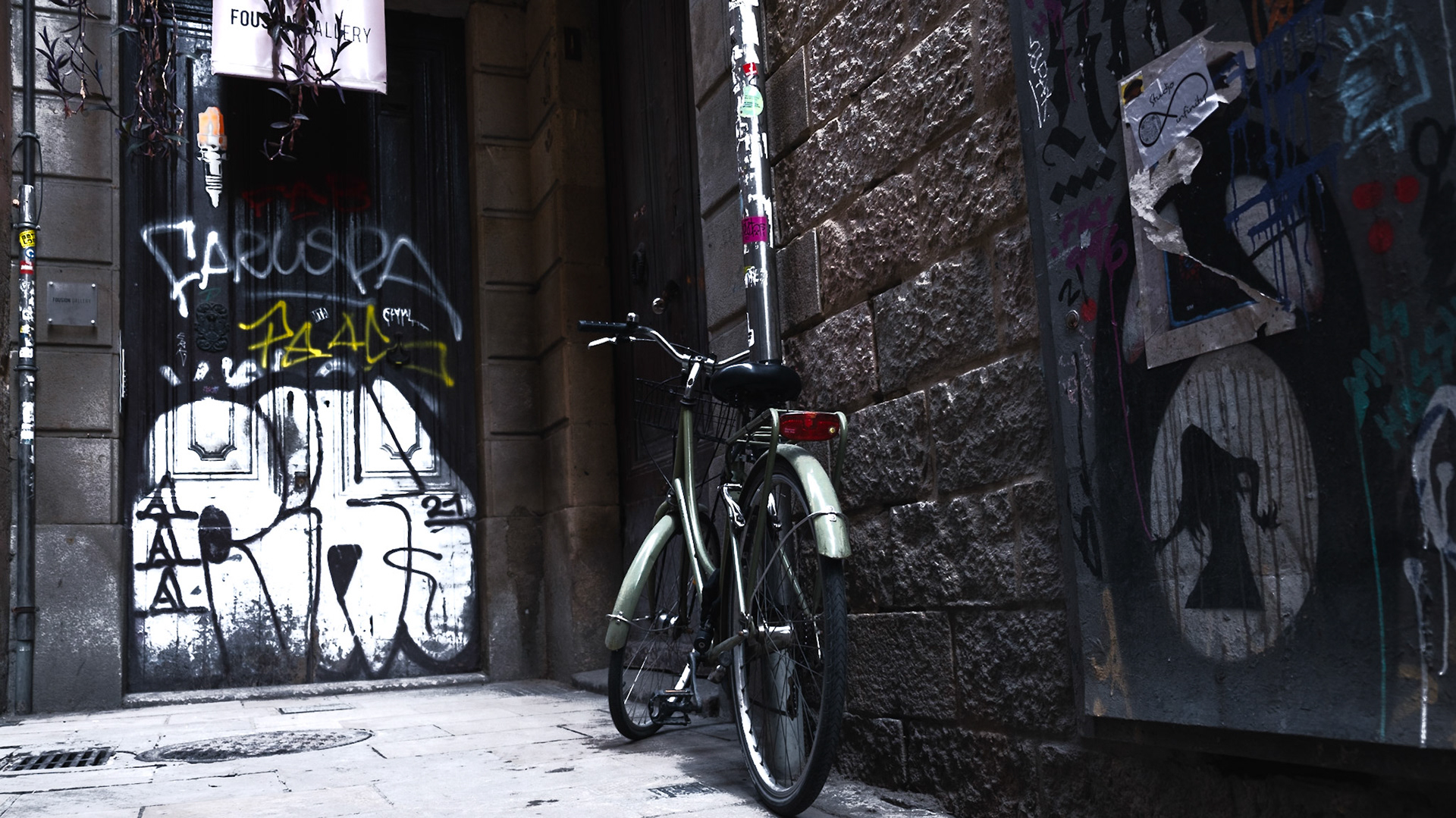 Bicycles and street art are omnipresent in Gothic Quarter in Barcelona
