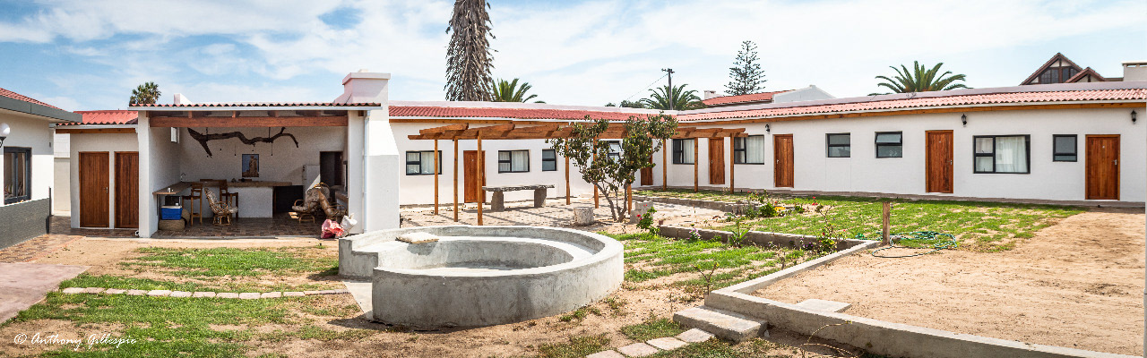 The courtyard and outside rooms at Beach Garden Accommodation.