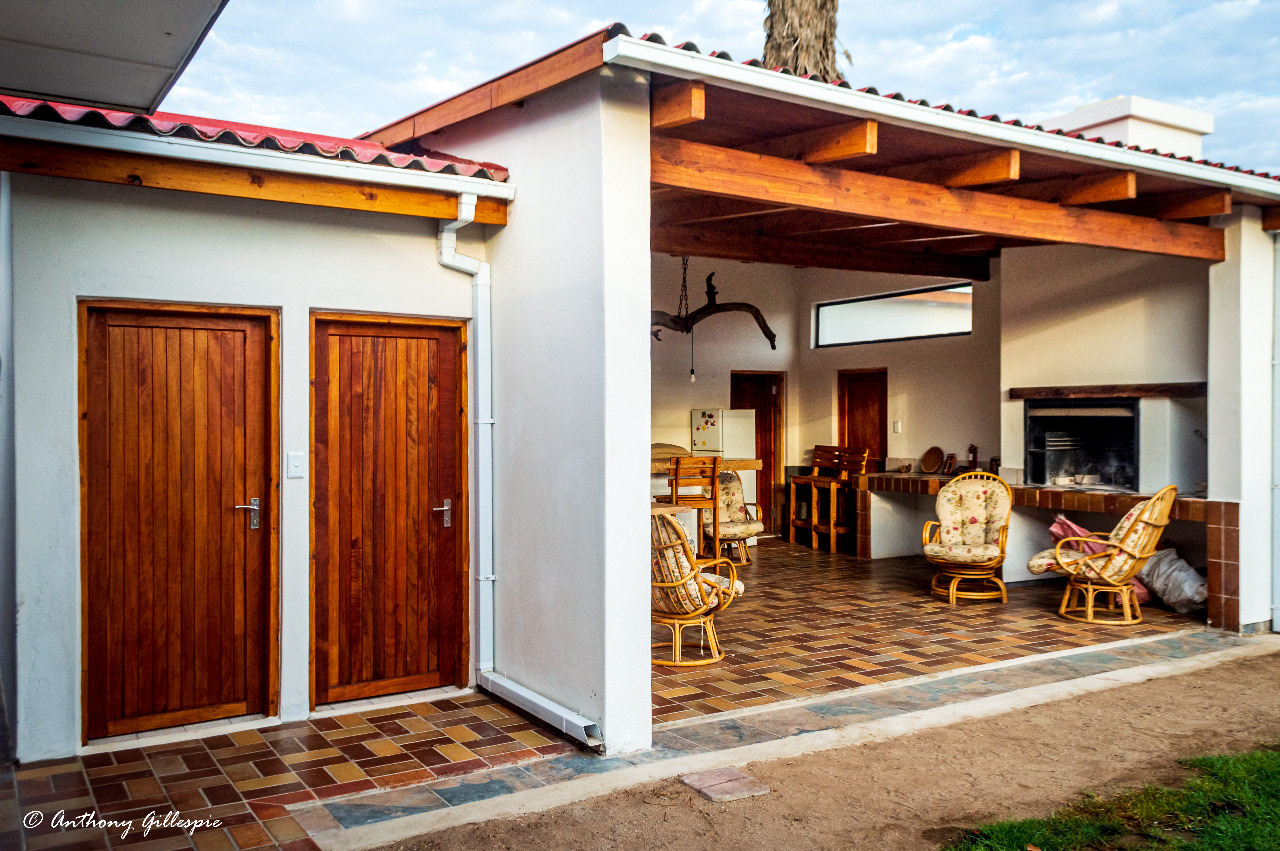 An courtyard view of the bar area and outside toilets.
