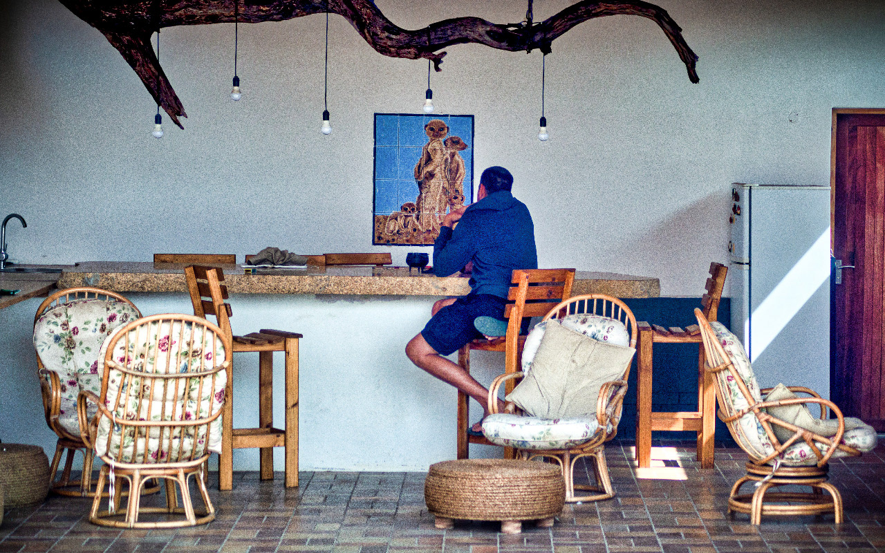 A resident sitting at the bar area having a breather.