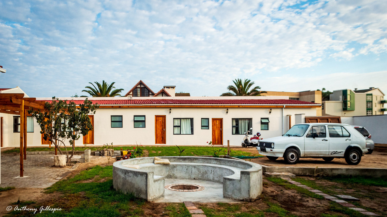 A view of the courtyard, firepit and parking areas from the communal dining area.