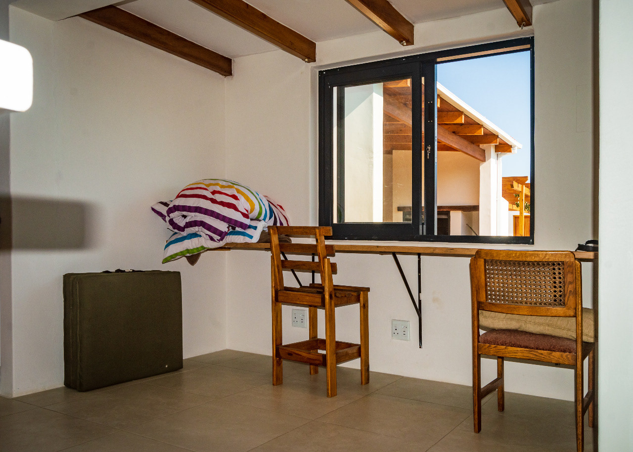 A window seat with a view to the courtyard and power outlets ideal for work spaces by Digital Nomads.