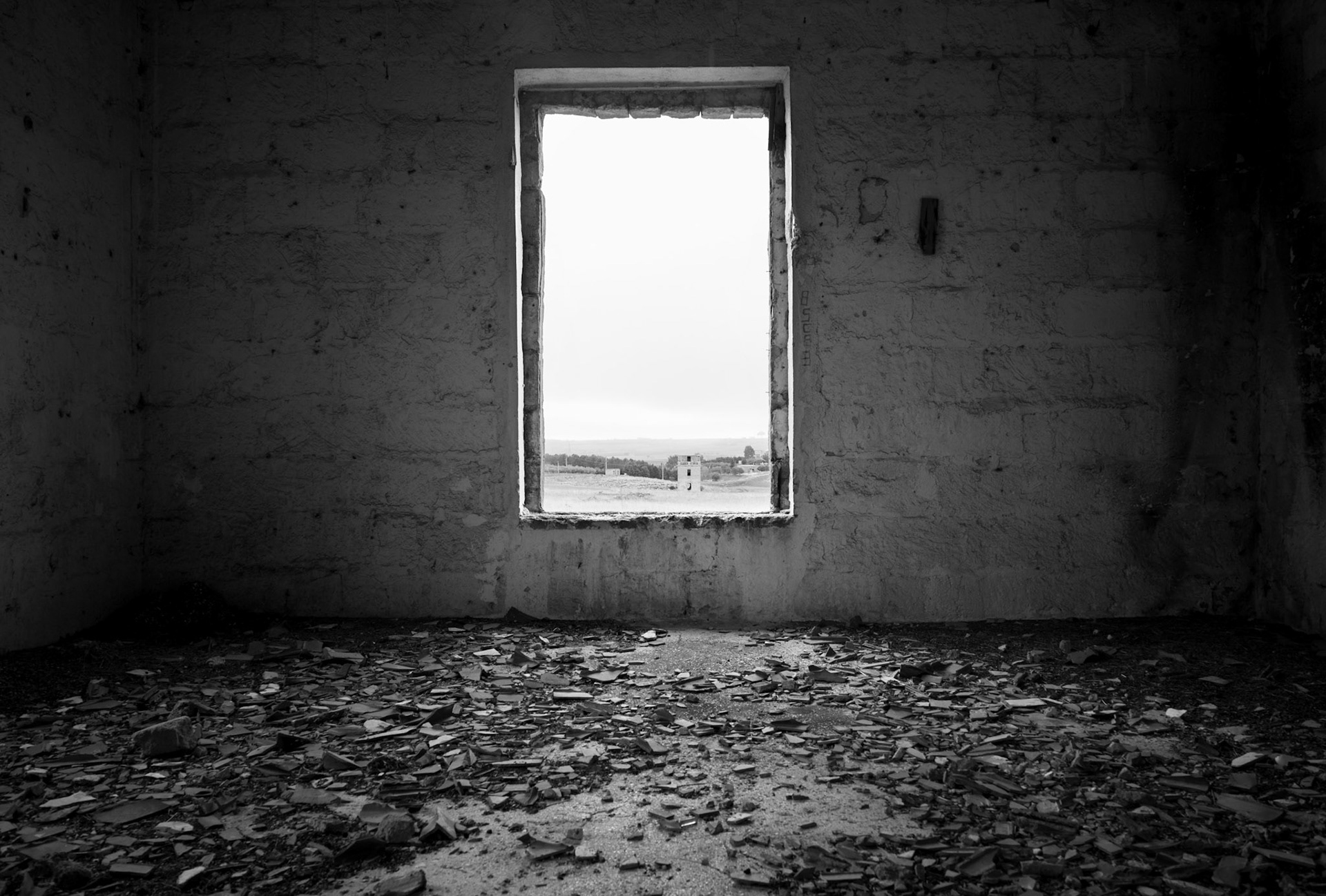 Interior of Camp 65. November 11, 2023. View from the window of one of the eight watchtowers used by the Royal Italian Army to monitor the Camp’s perimeter. All eight towers miraculously survived the destruction of about 95% of the Camp’s structures in the late 1980s.