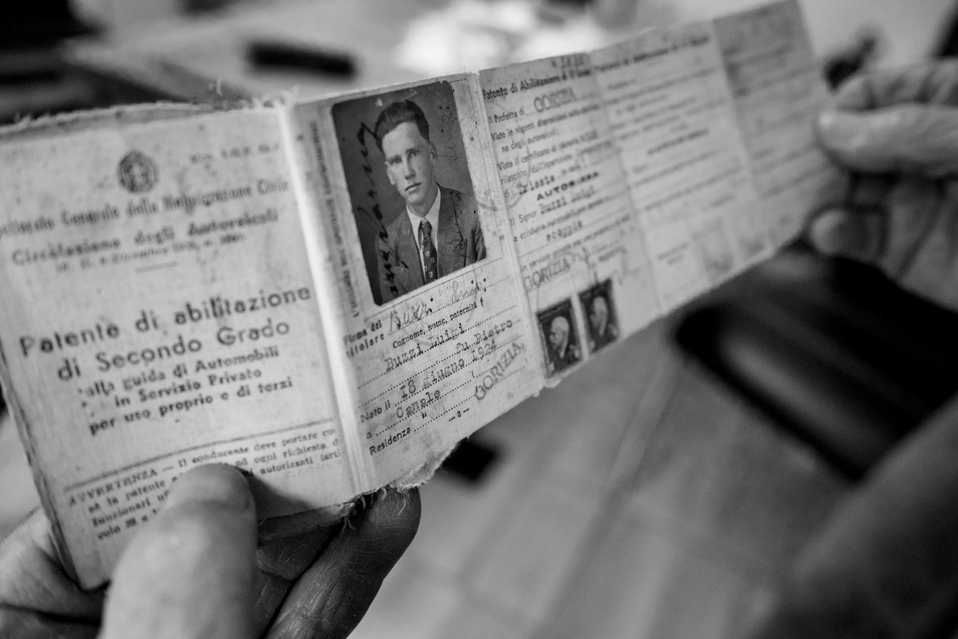Civilian driving license obtained by Luigi Buzzi. Tolmin, Slovenia. February 23, 2025. As part of Fascist policies of forced Italianization, all Slavic names were translated into Italian—often poorly. Alojz Buzic became Luigi Buzzi. Thanks to his civilian driving license, he was assigned to the rearguard and logistics roles during his partisan service. After the war, Alojz continued working as a driver in the fire brigade.