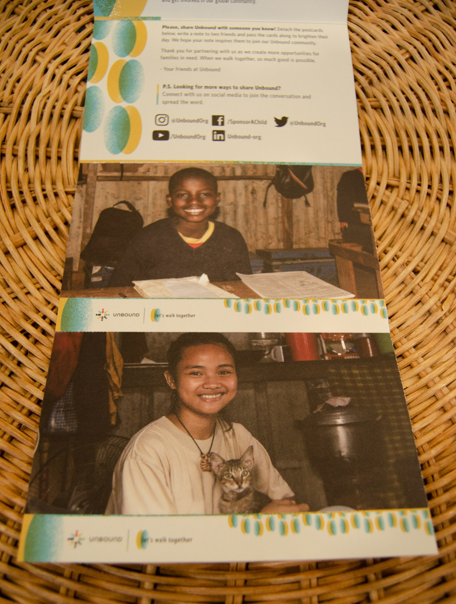 The mailer completely open, showing the tear-off postcard sponsors can send to friends.