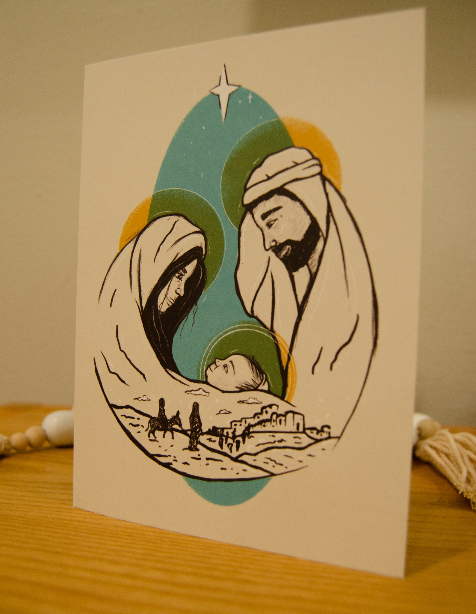 The front of the Christmas card, featuring the Holy Family.