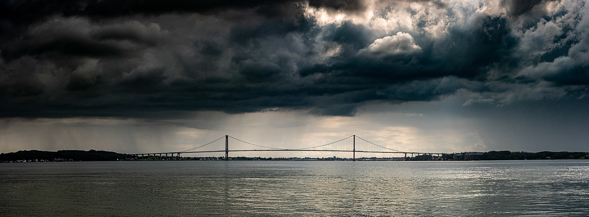 I have crossed that bridge more time than I can count, and  this time I stopped to get a photo of it. I actually didn't see the clouds until I got home and looked at the photo.