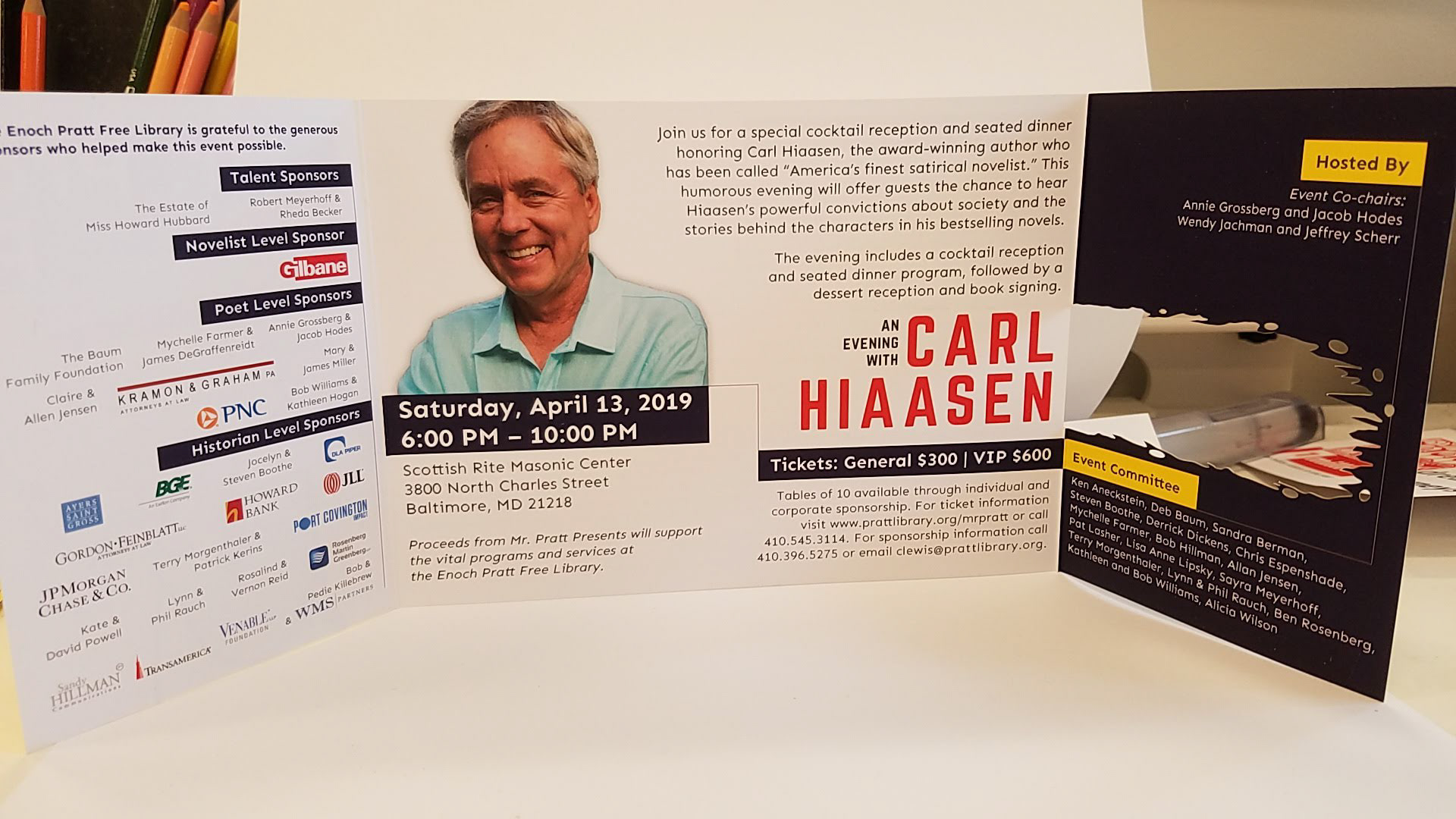 Invitation interior for Enoch Pratt Free Library's annual gala, 2019. Gatefold invitation with custom die cut in the shape of an alligator bite.