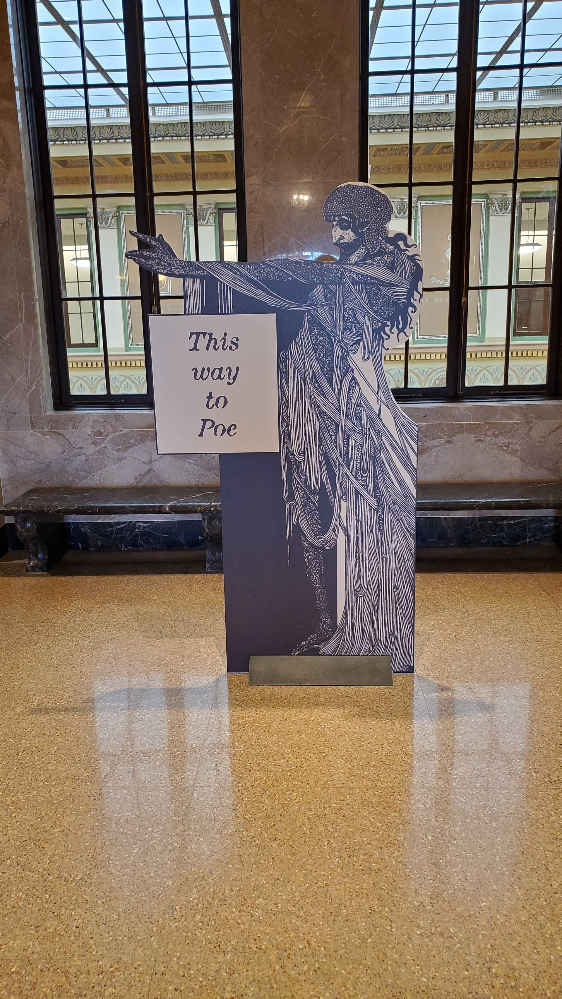Directional cutout stanchion pointing to the main exhibit. 