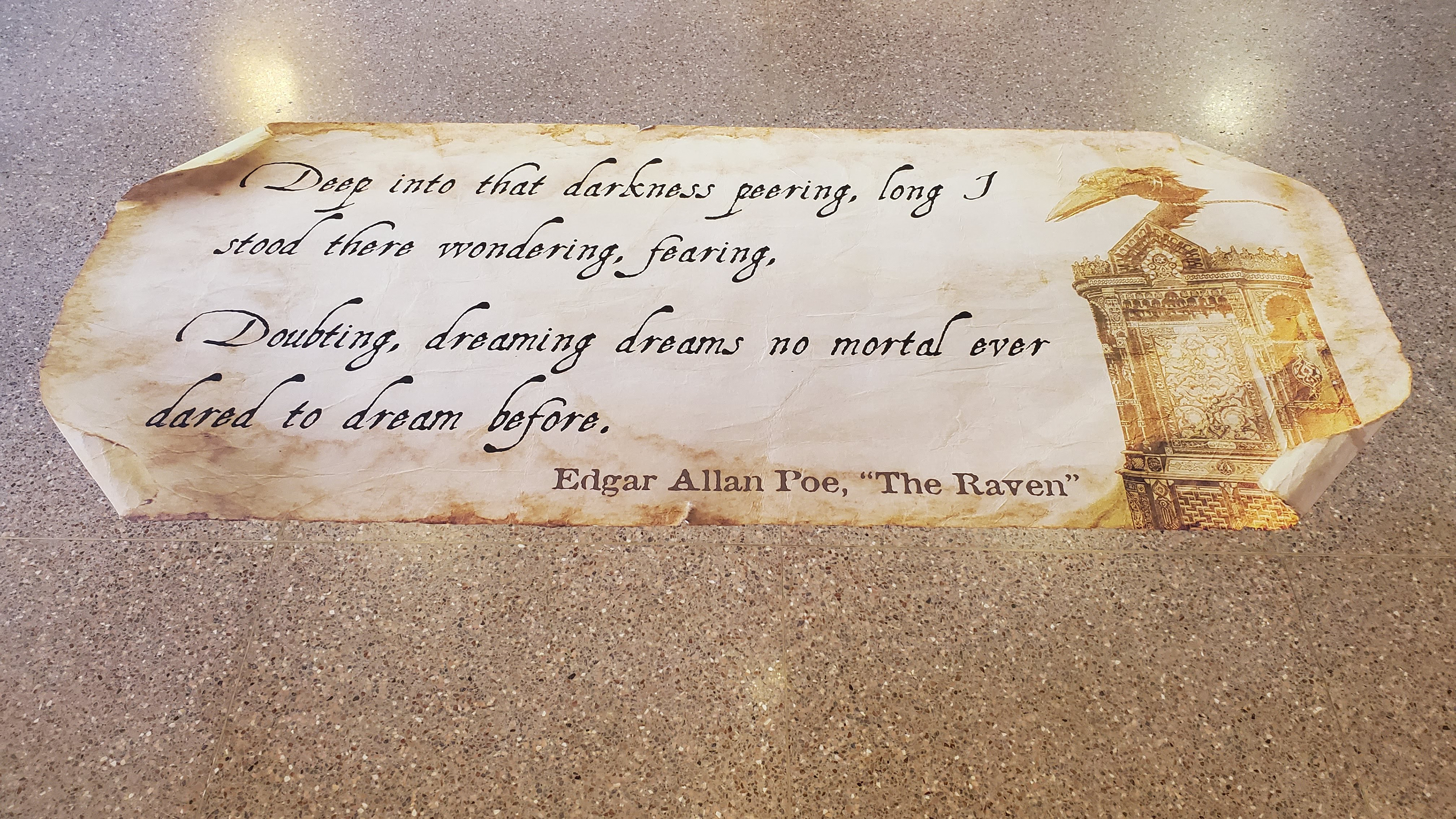 Floor vinyl graphic installed, placed in front of the introduction case.