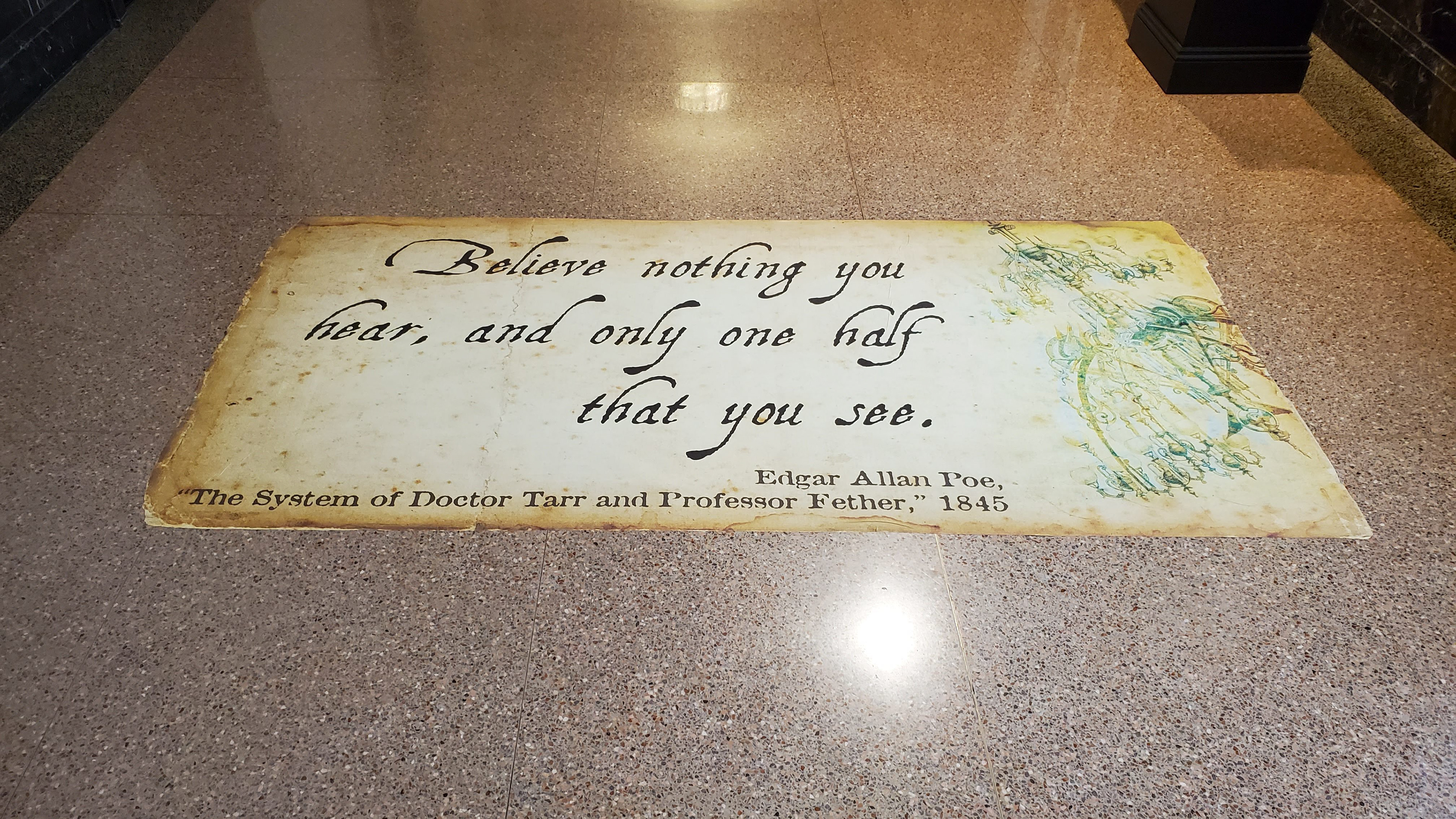 Floor vinyl graphic installed, placed in hallway leading to the main exhibit.