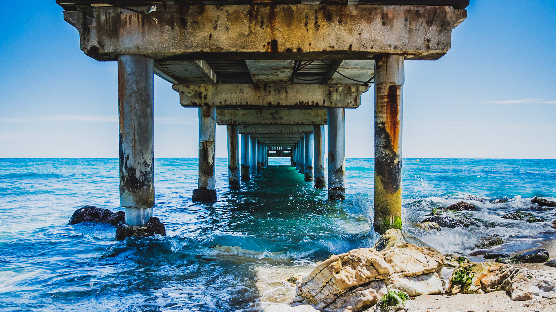 Underneath the pier.