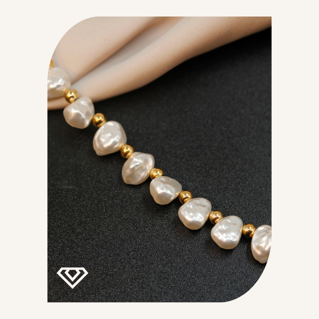 Pulsera diseño acero y perlas. Brilla por: 7500 crc