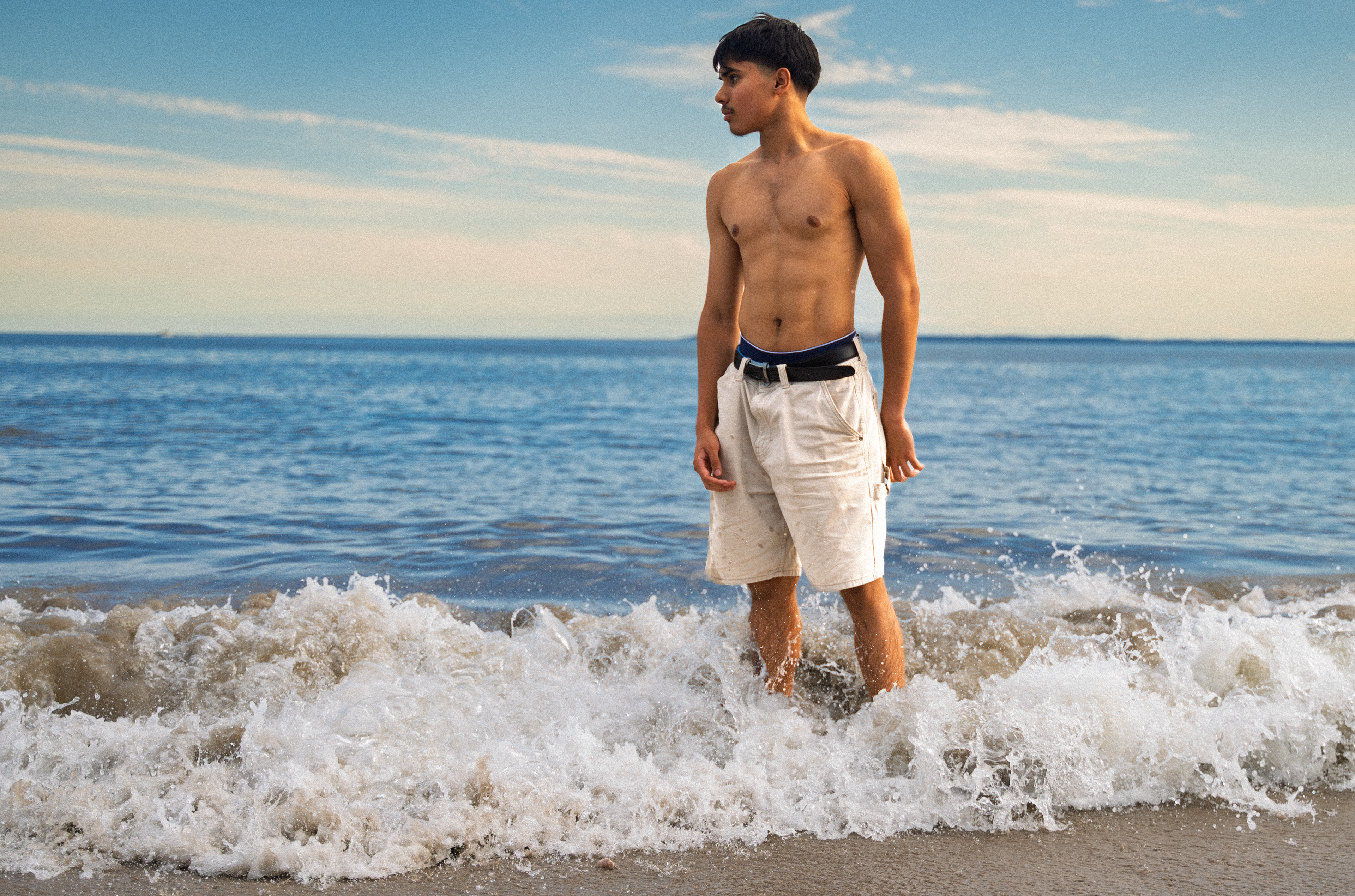 CONEY ISLAND, NEW YORK - JULY 19, 2025: Mohammed photographs an American football scene on the beach at Coney Island, Brooklyn, inspired by Top Gun: Maverick.