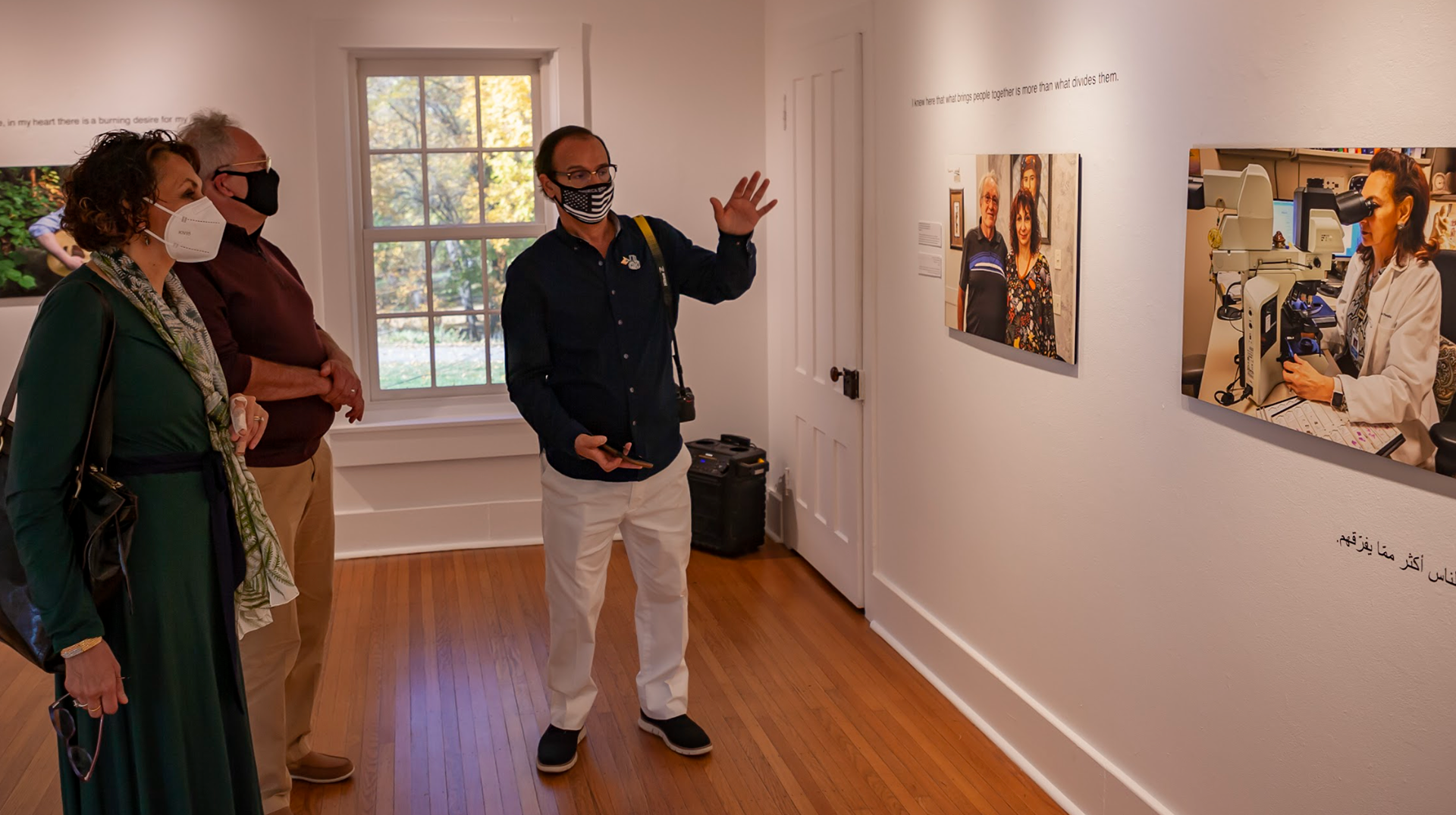 Artist Ahmed Alshaikhli talks about his work to the visitors
