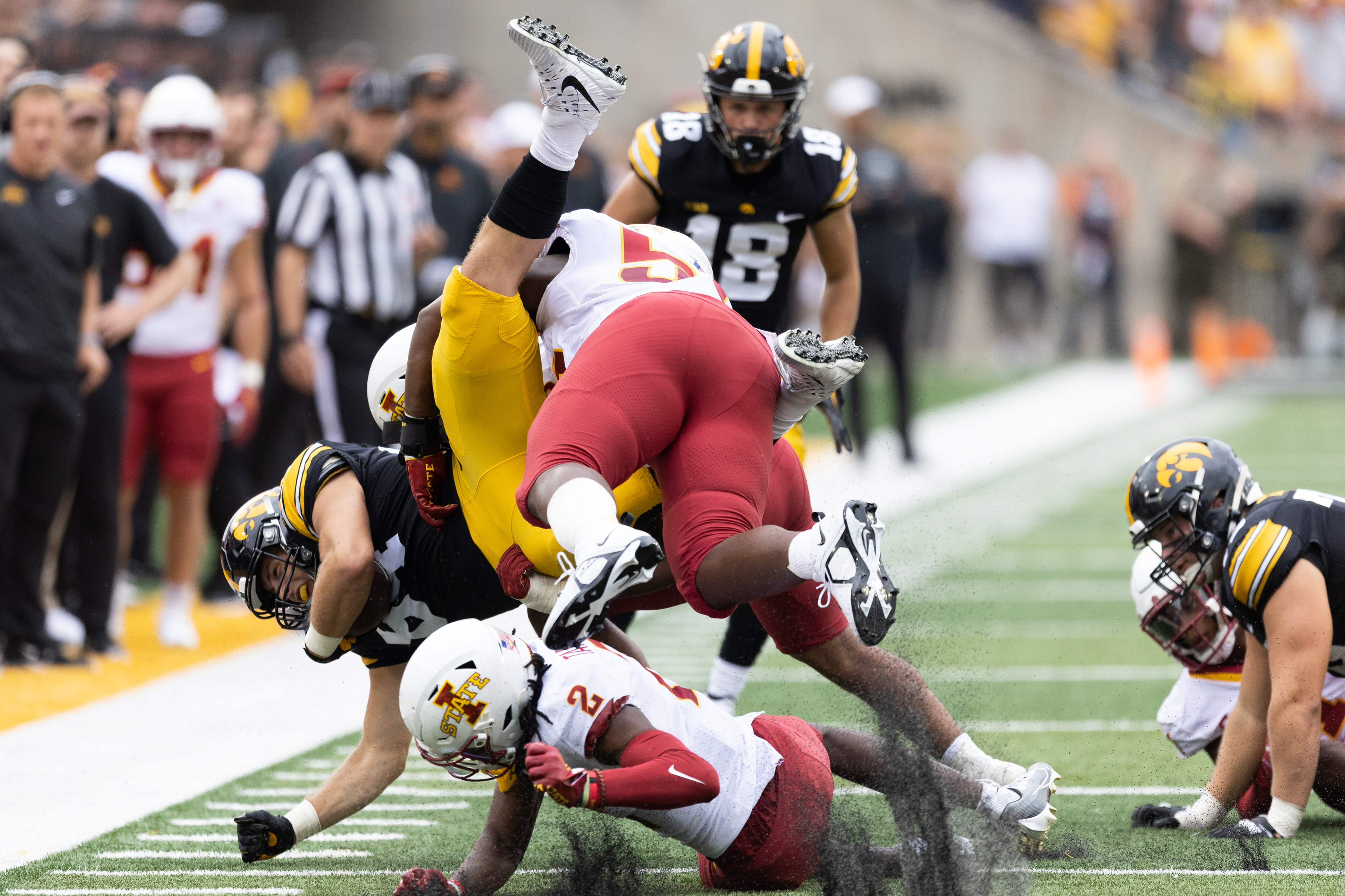 Iowa Hawkeyes tight end Sam LaPorta (84) is tackled by two Cyclones players during a NCAA football game between the Iowa Hawkeyes and the Iowa State Cyclones at Kinnick Stadium in Iowa City, Iowa on Saturday, Sept. 10, 2022.