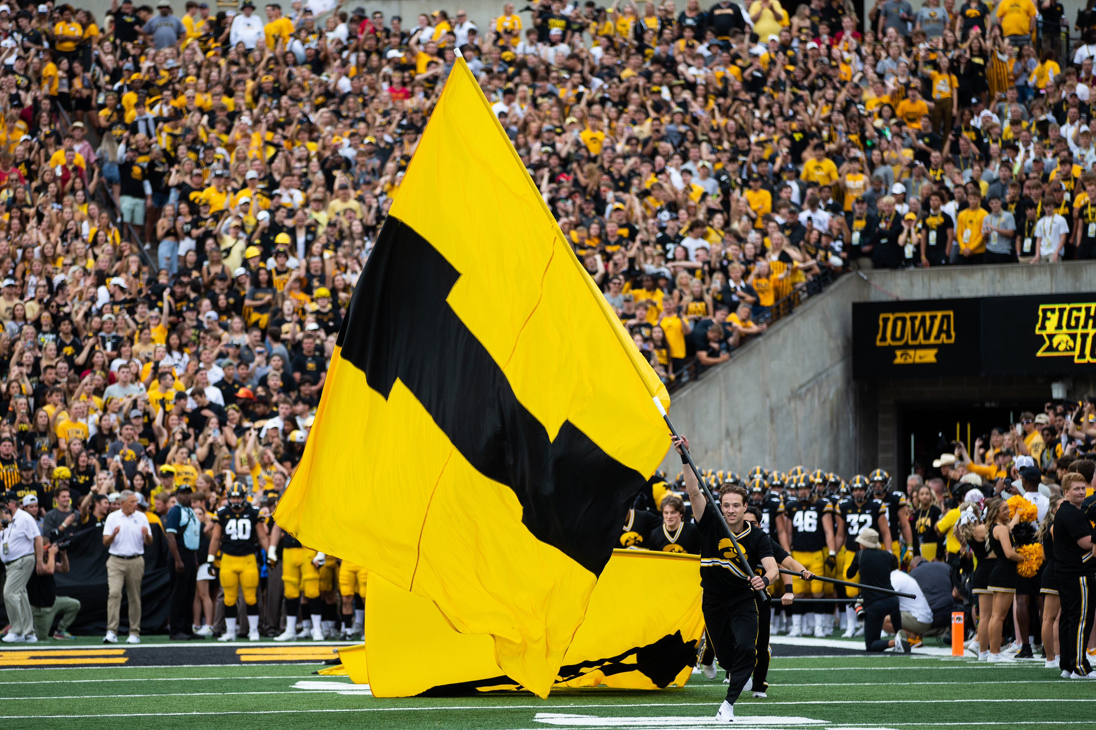 The Iowa Hawkeyes come onto the field during a NCAA football game between the Iowa Hawkeyes and the Iowa State Cyclones at Kinnick Stadium in Iowa City, Iowa on Saturday, Sept. 10, 2022.