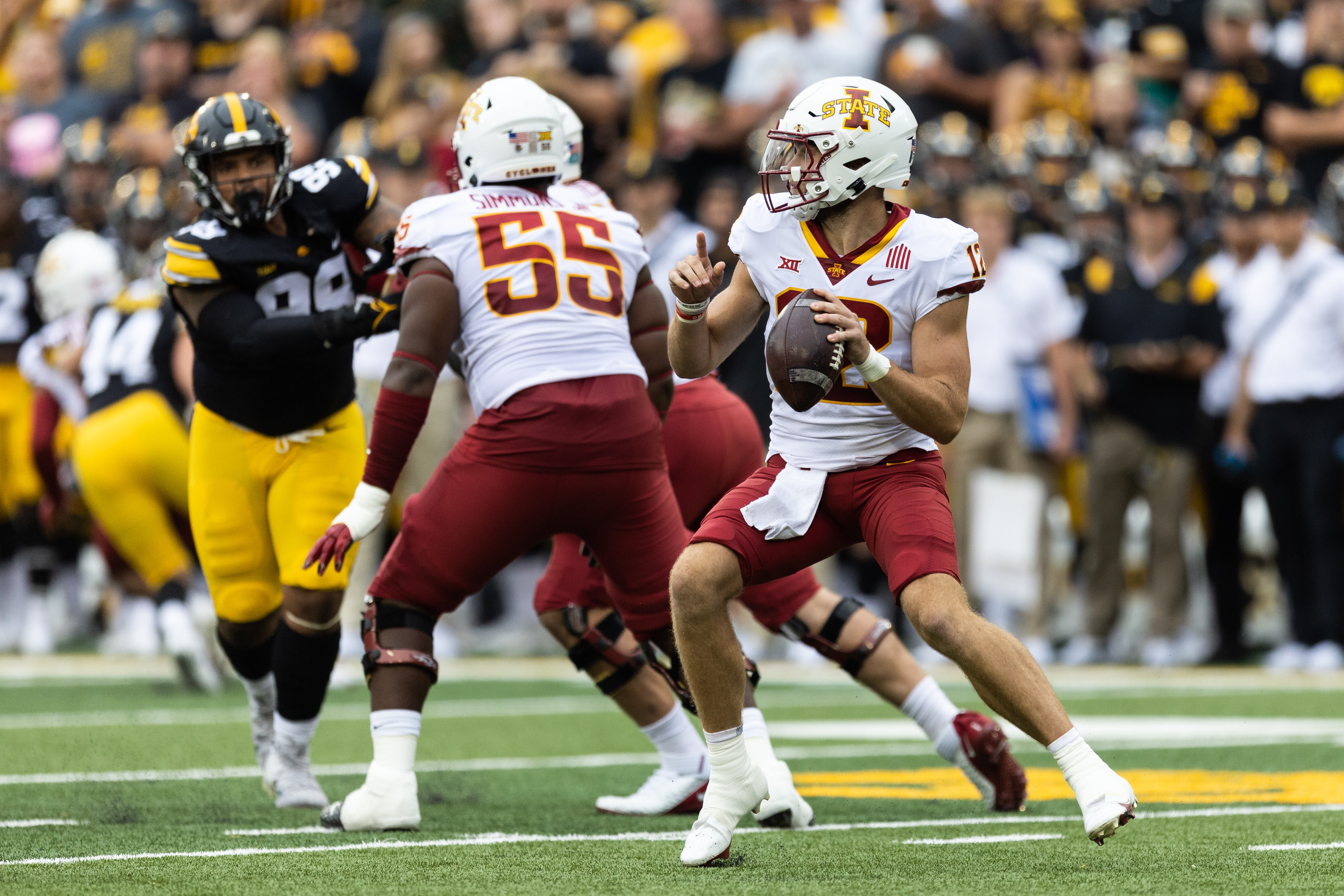 Iowa State Cyclones quarterback Hunter Dekkers (12) drops back to pass during a NCAA football game between the Iowa Hawkeyes and the Iowa State Cyclones at Kinnick Stadium in Iowa City, Iowa on Saturday, Sept. 10, 2022.