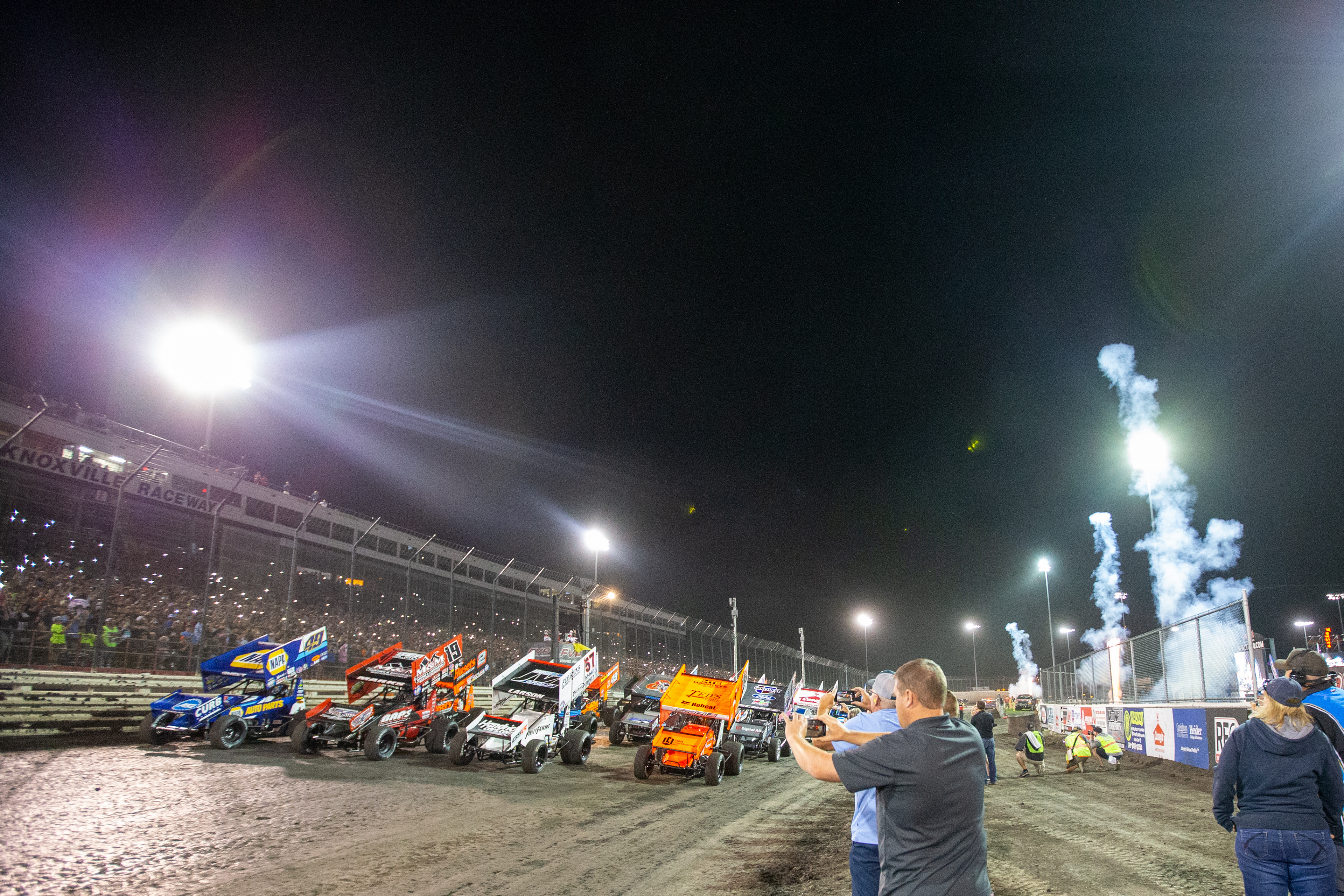 The field lines up four-wide before the start of the A-main feature of the the 60th Annual NOS Energy Drink Knoxville Nationals presented by Caseys Championship Night at Knoxville Raceway in Knoxville, Iowa on Saturday, Aug. 14, 2021.