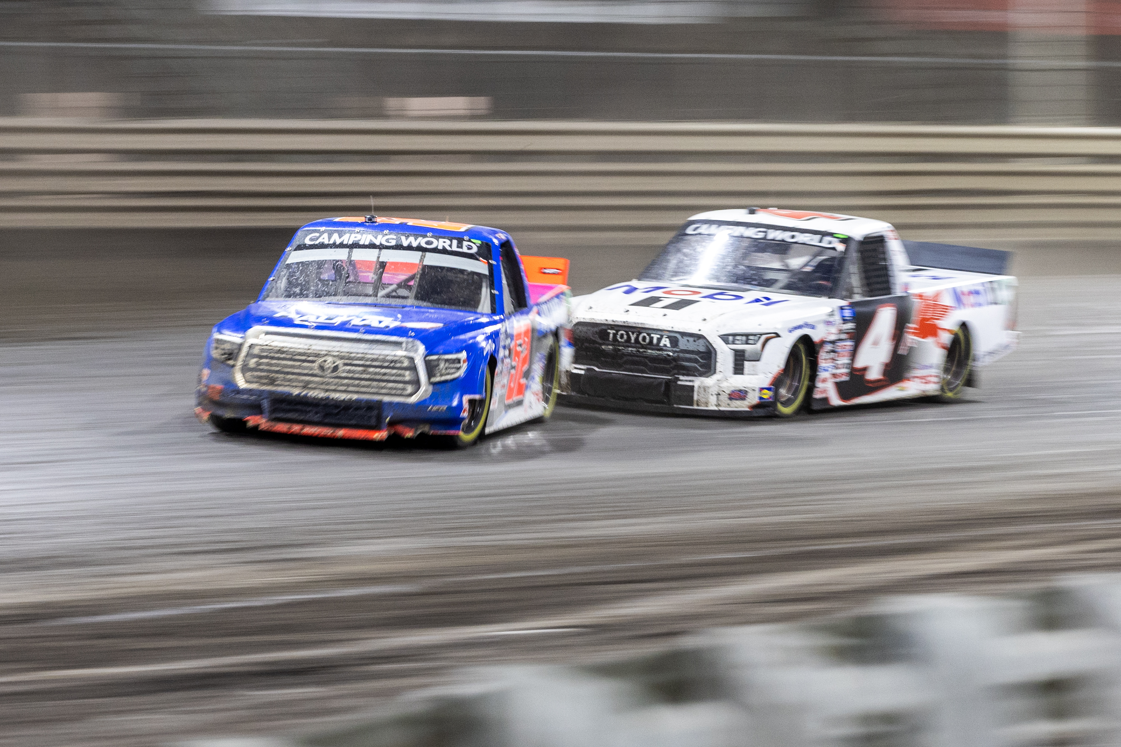 NASCAR Gander RV and Outdoors Truck Series driver Stewart Friesen (52) and NASCAR Gander RV and Outdoors Truck Series driver John Hunter Nemechek (4) make contact during the Clean Harbors 150 NASCAR Camping World Truck Series Race at Knoxville Raceway in Knoxville, Iowa on Saturday, June 18, 2022.