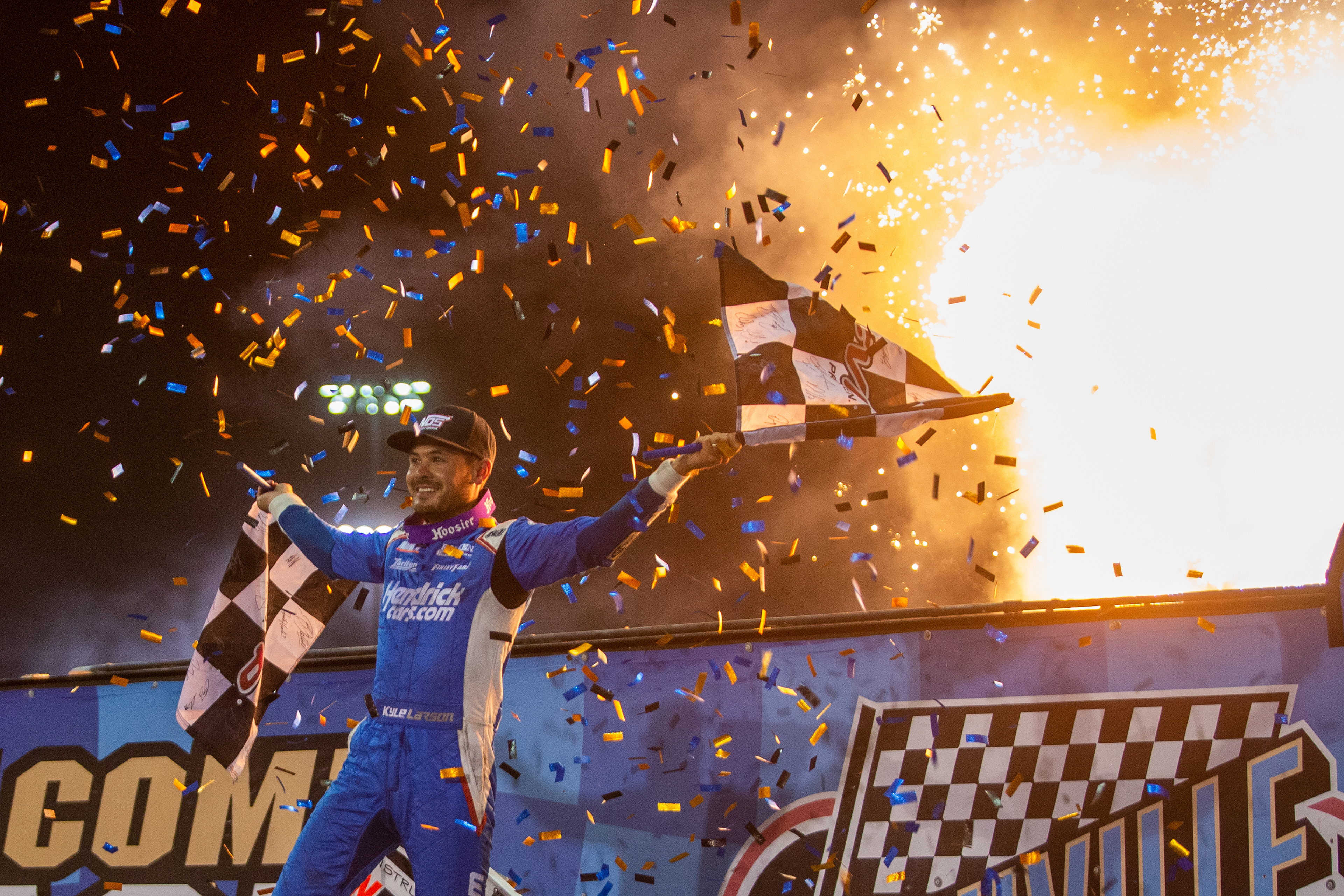 Kyle Larson (57), of Elk Grove, California, celebrates winning the 60th Annual NOS Energy Drink Knoxville Nationals presented by Caseys Championship Night at Knoxville Raceway in Knoxville, Iowa on Saturday, Aug. 14, 2021.