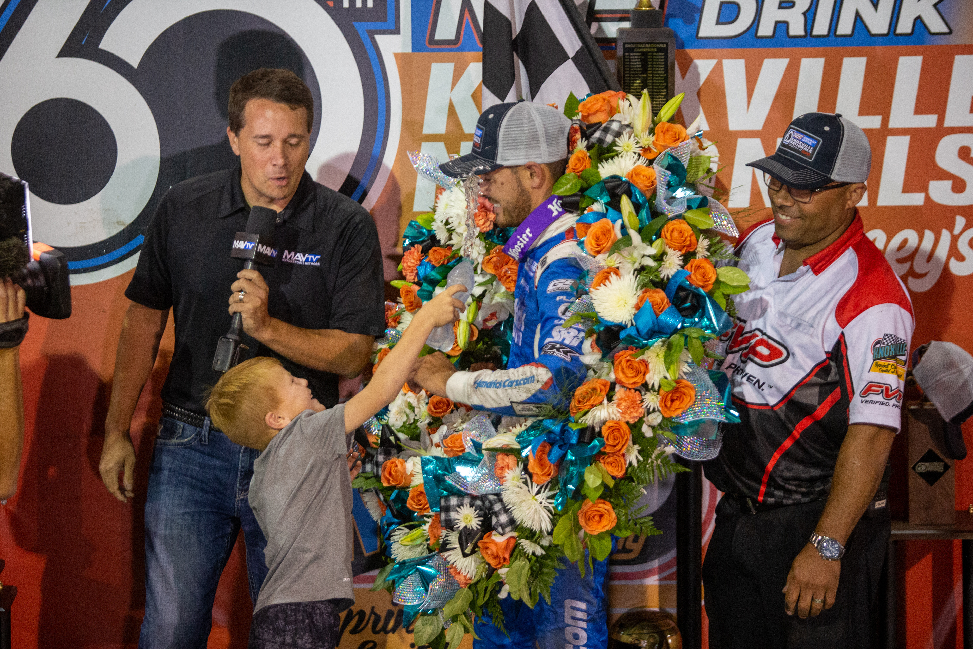 Kyle Larson (57), of Elk Grove, California, celebrates with his son after winning the 60th Annual NOS Energy Drink Knoxville Nationals presented by Caseys Championship Night at Knoxville Raceway in Knoxville, Iowa on Saturday, Aug. 14, 2021.