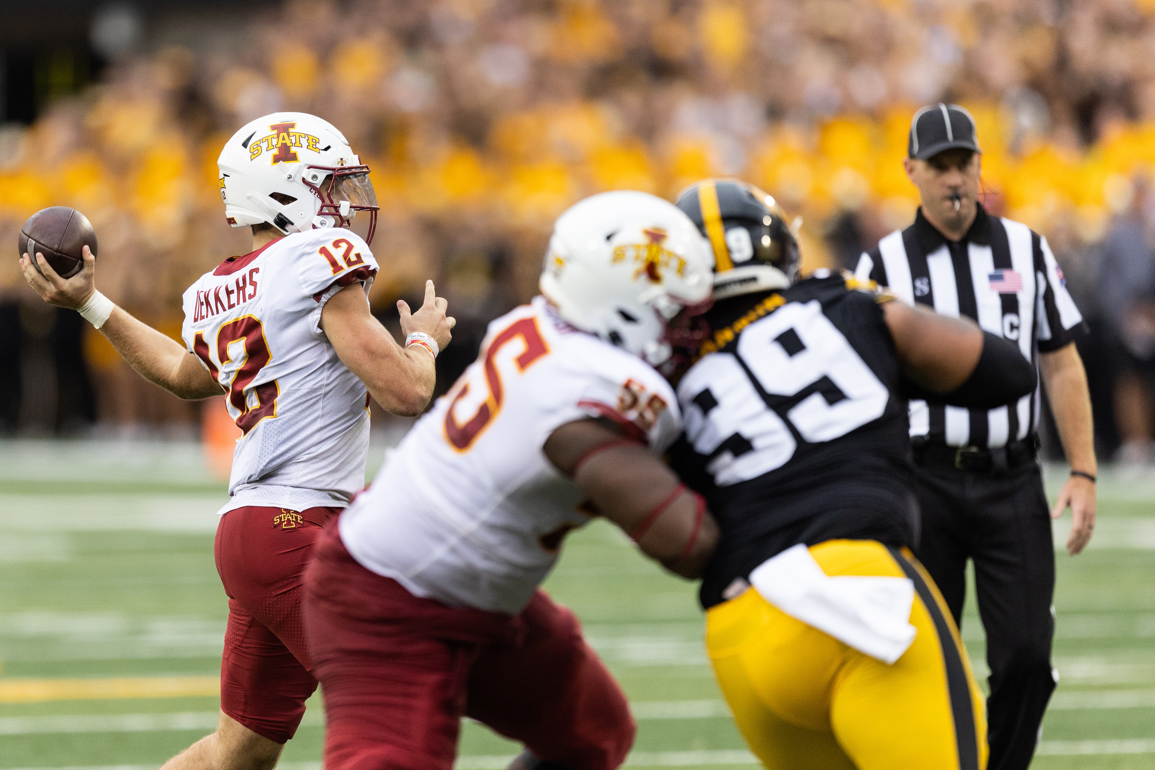 Iowa State Cyclones quarterback Hunter Dekkers (12) looks to pass during a NCAA football game between the Iowa Hawkeyes and the Iowa State Cyclones at Kinnick Stadium in Iowa City, Iowa on Saturday, Sept. 10, 2022.